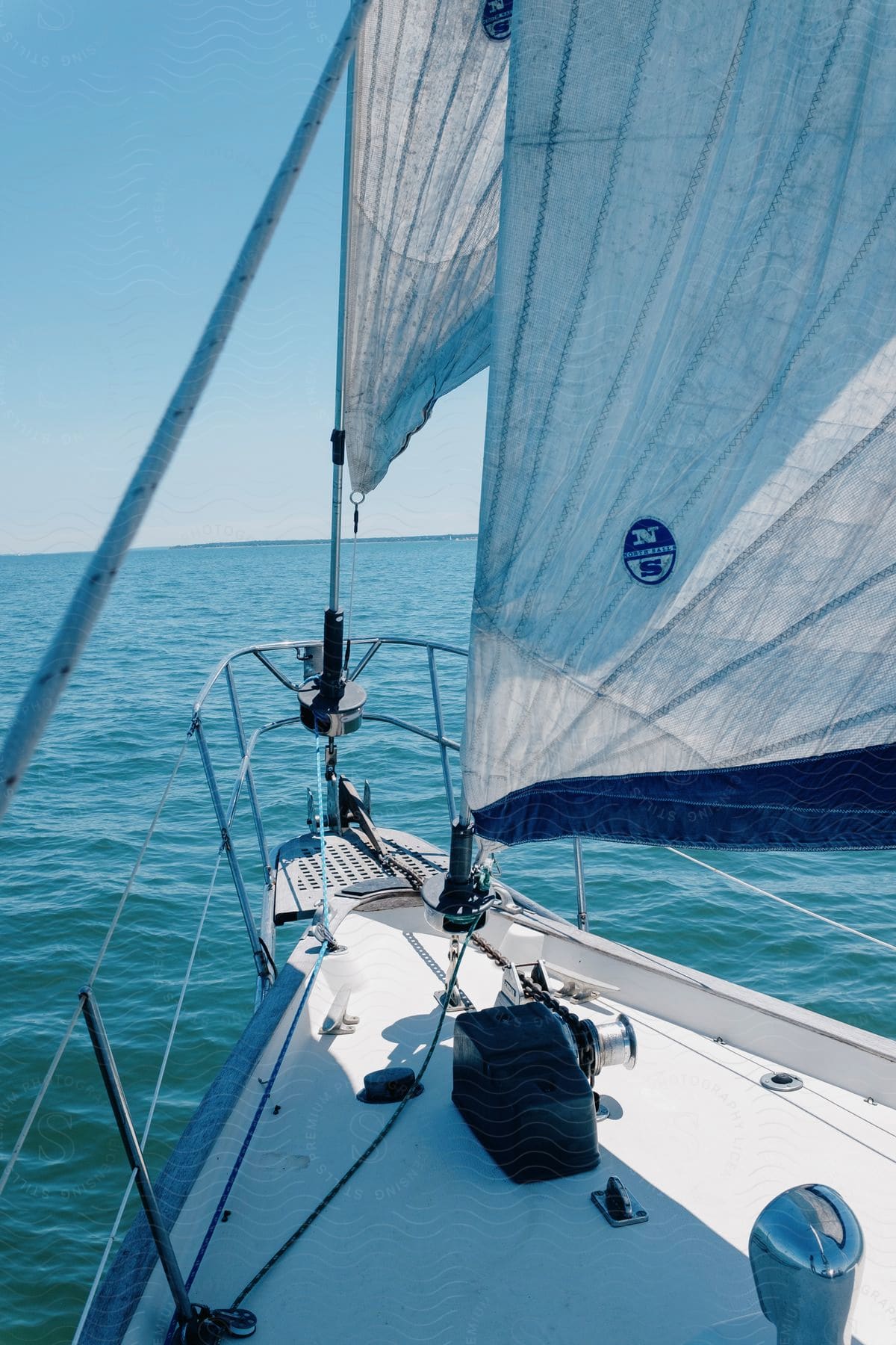 the front of a sailboat sailing in the ocean