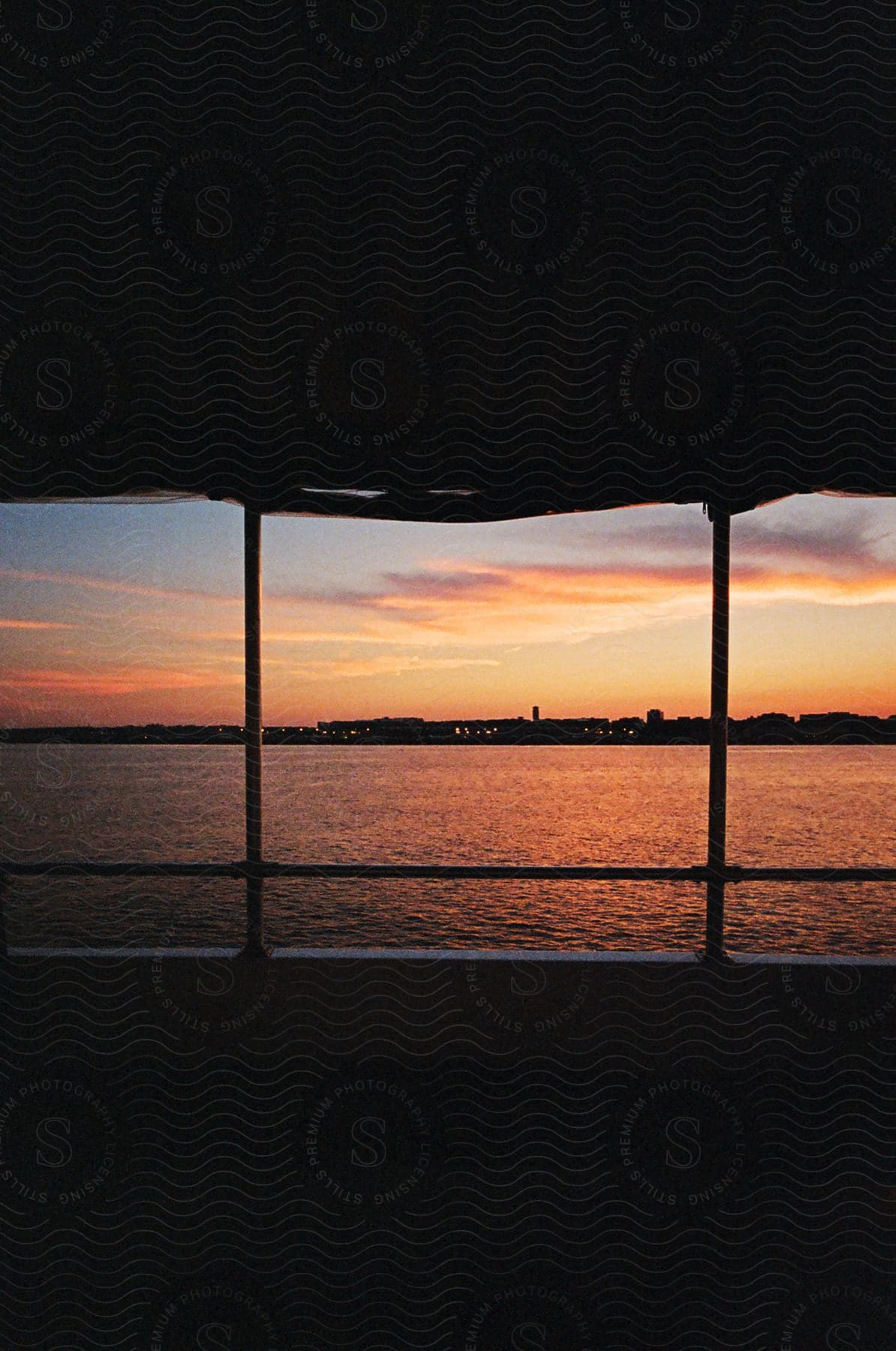 View from inside a boat with the sea landscape on a red sky day