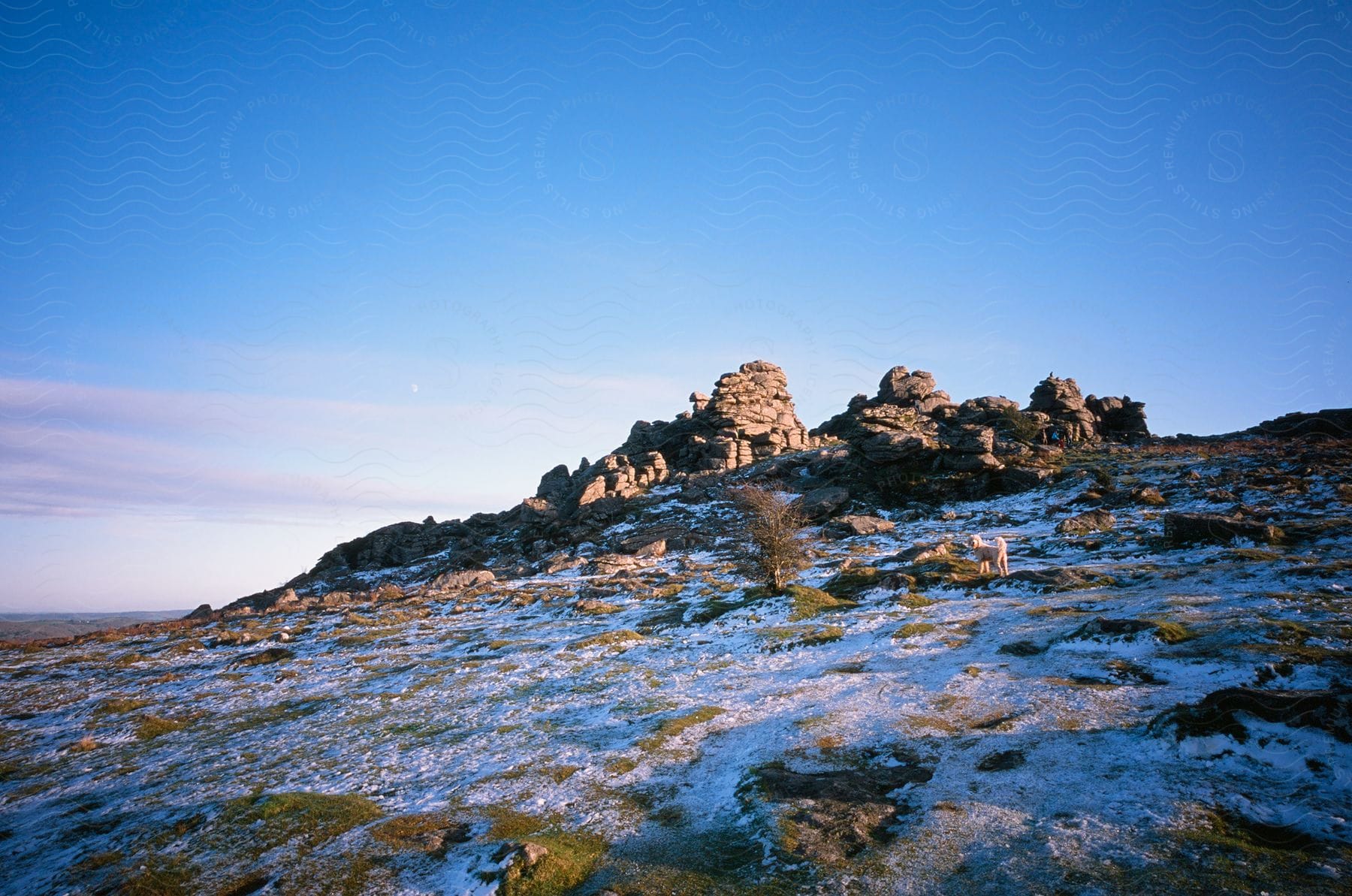 Aerial of a mountain with snow melting in the morning.