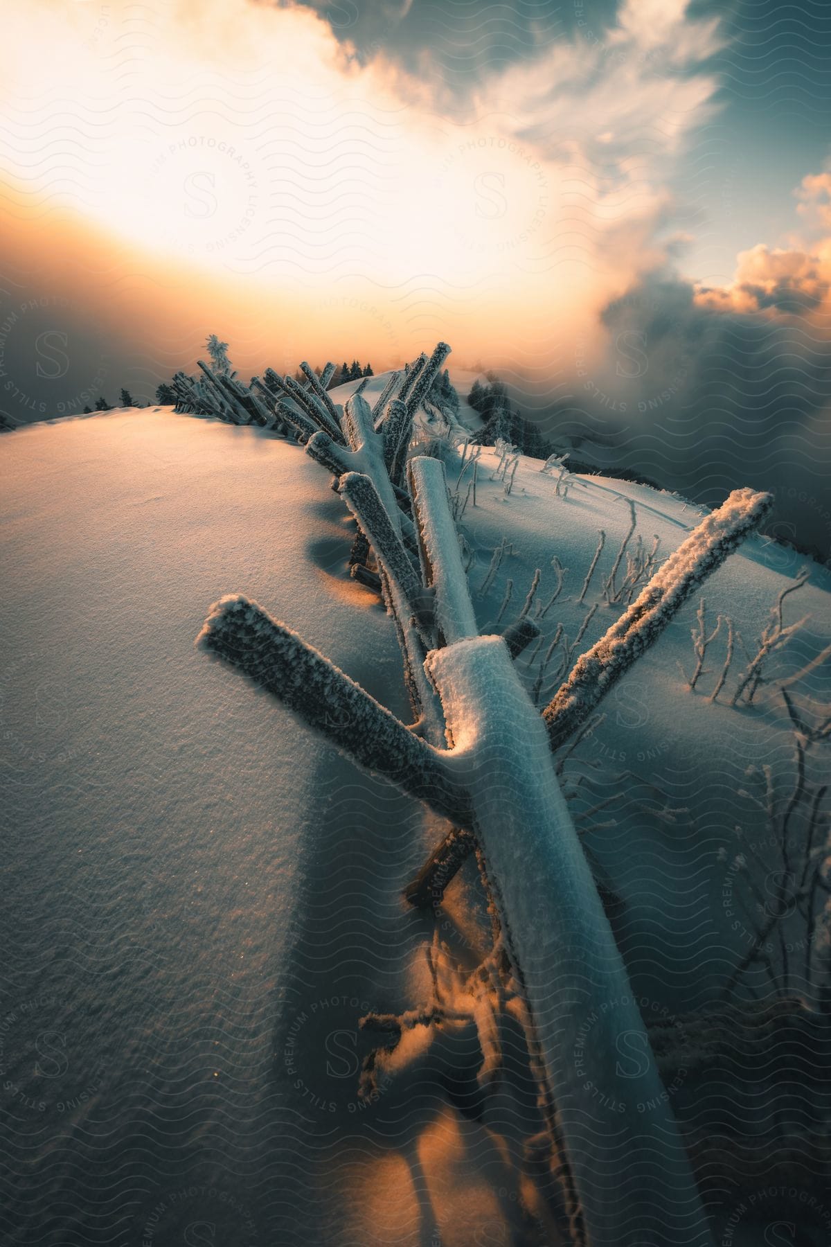 Stakes On Top Of A Snow-covered Mountain On A Cloudy Morning