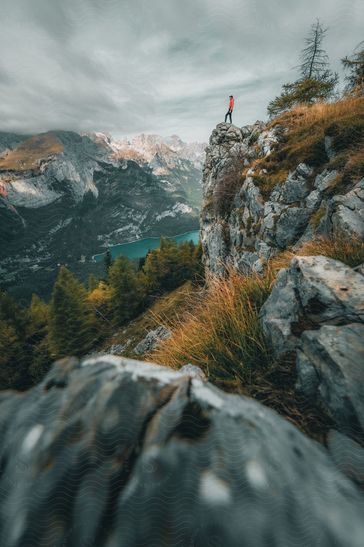 A person standing at the edge of a cliff outdoors