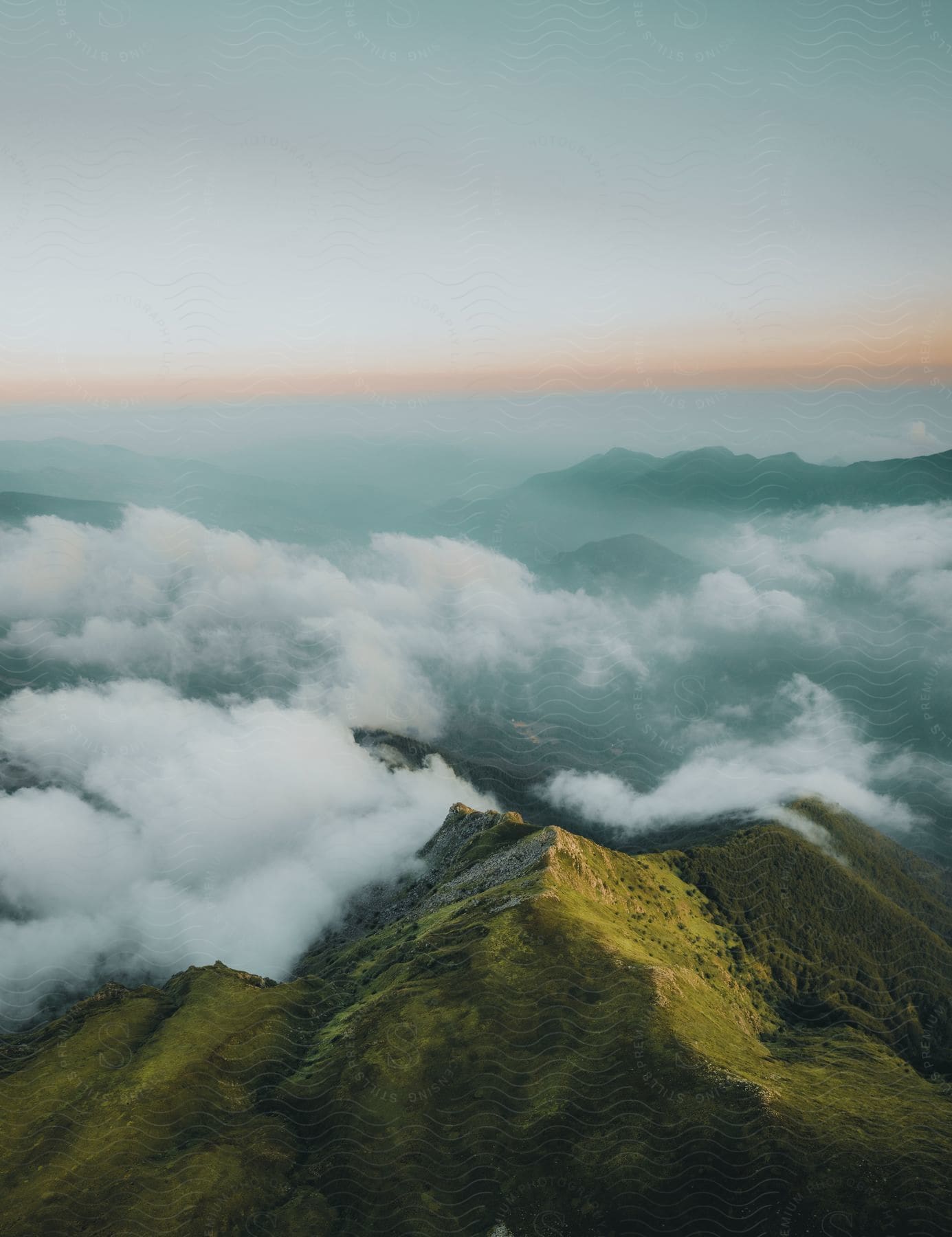 a mountain range with a cloud