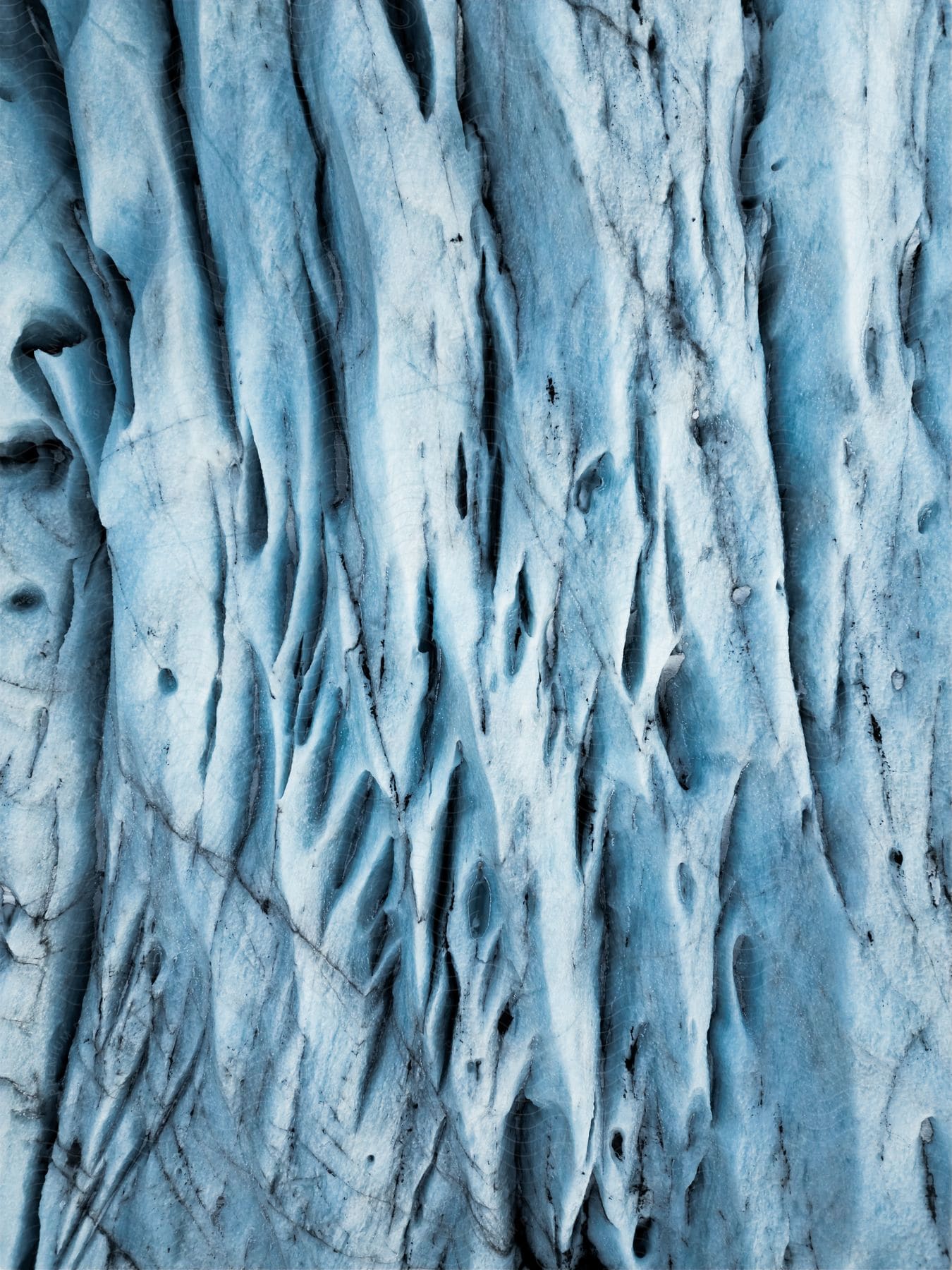 Aerial of an Arctic ice cap during the day.