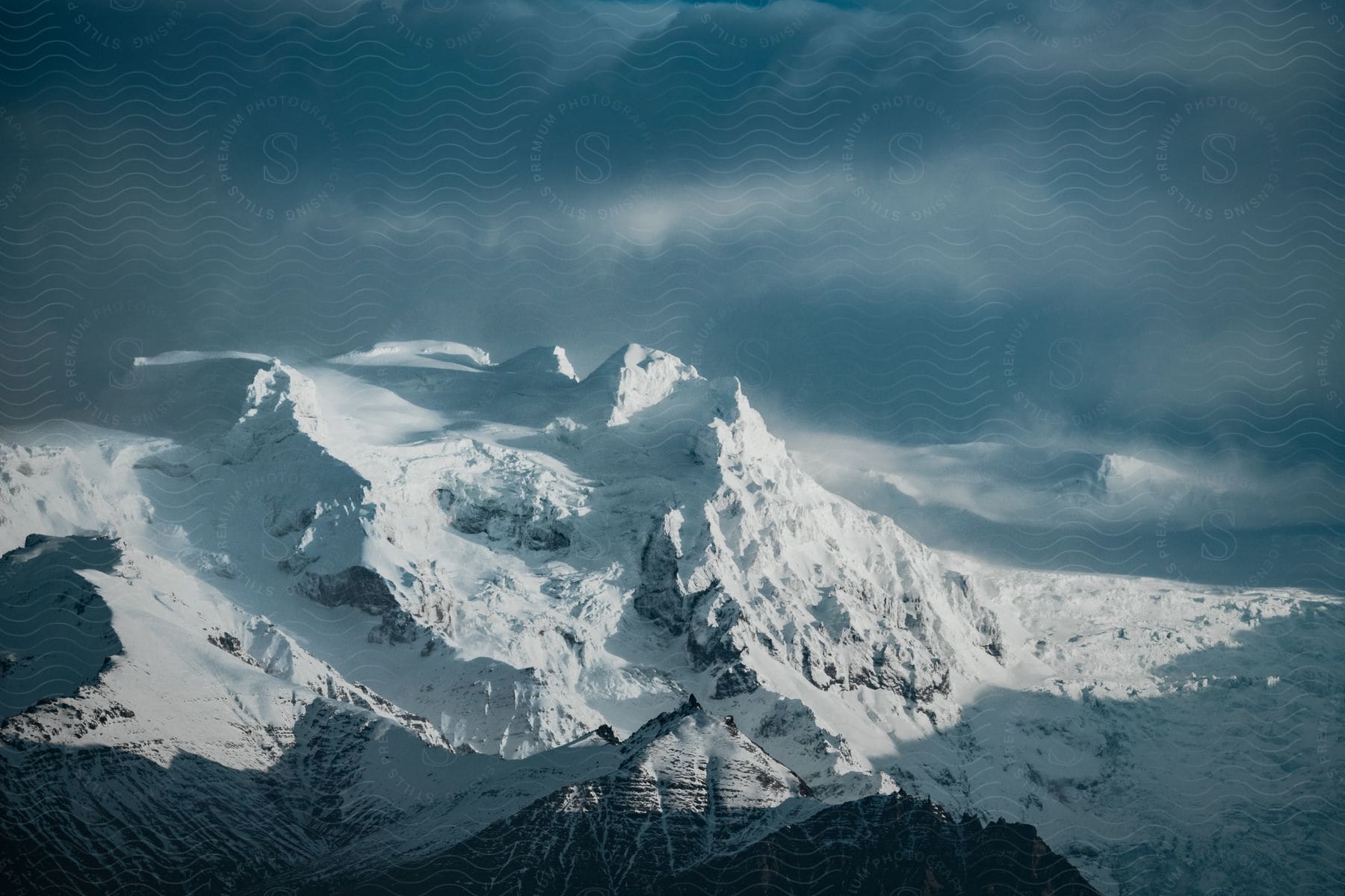 A huge mountain is completely covered in snow