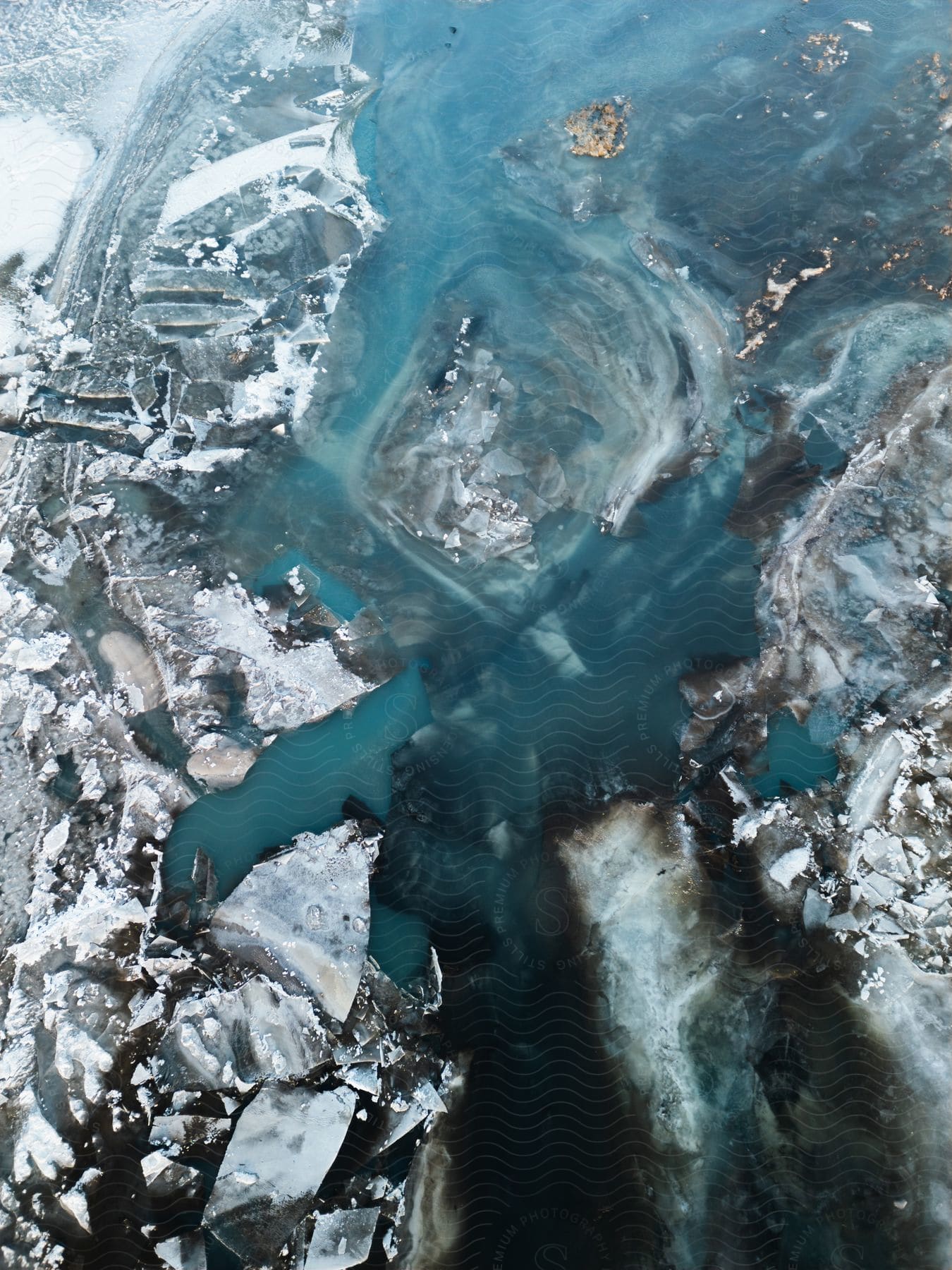 Rock, ice and water viewed from above.