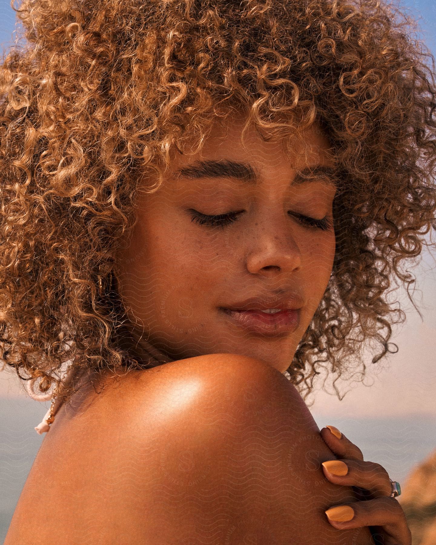 A portrait of a woman modeling outdoors.