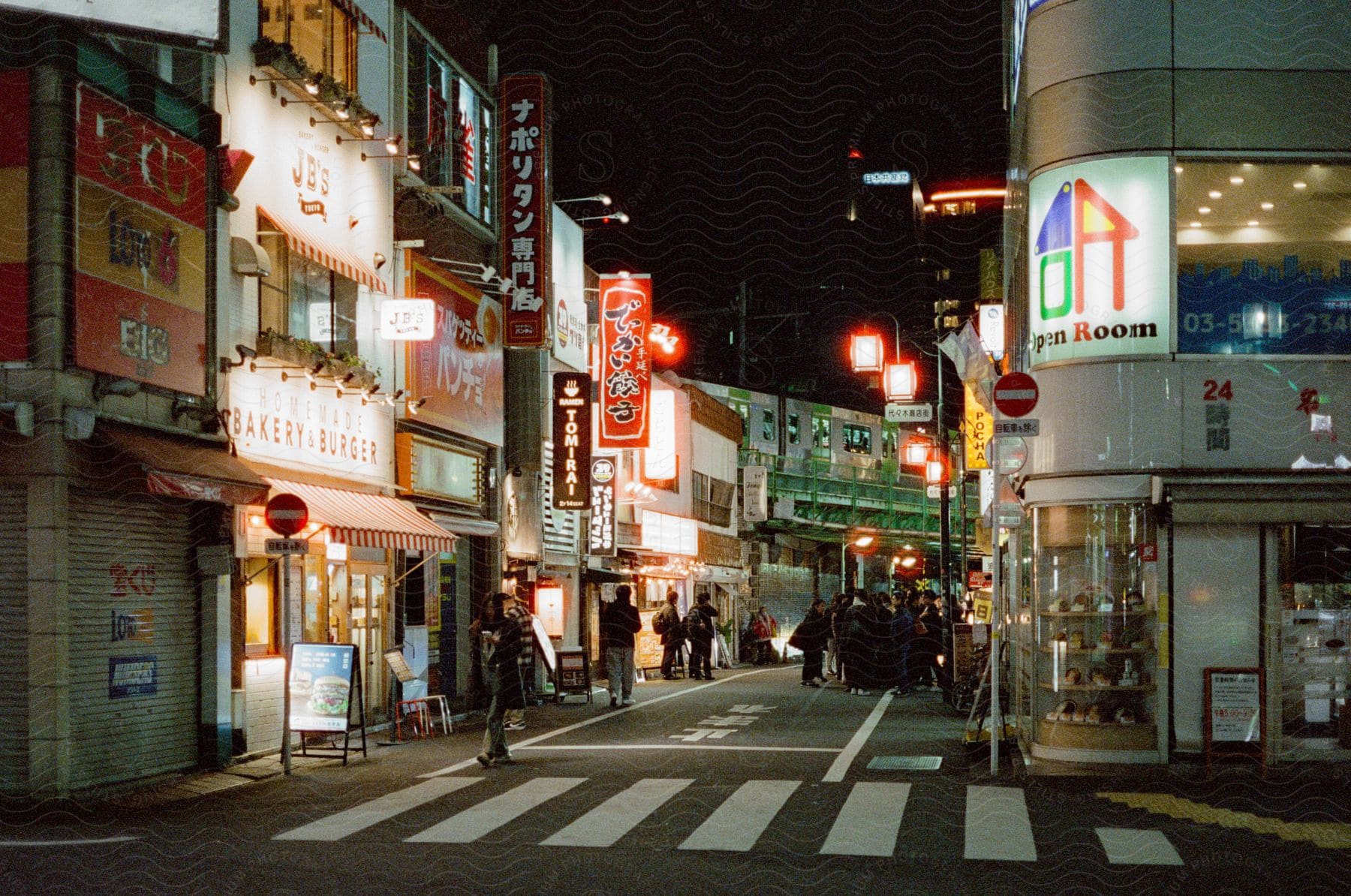 Japanese street signs and shops at night