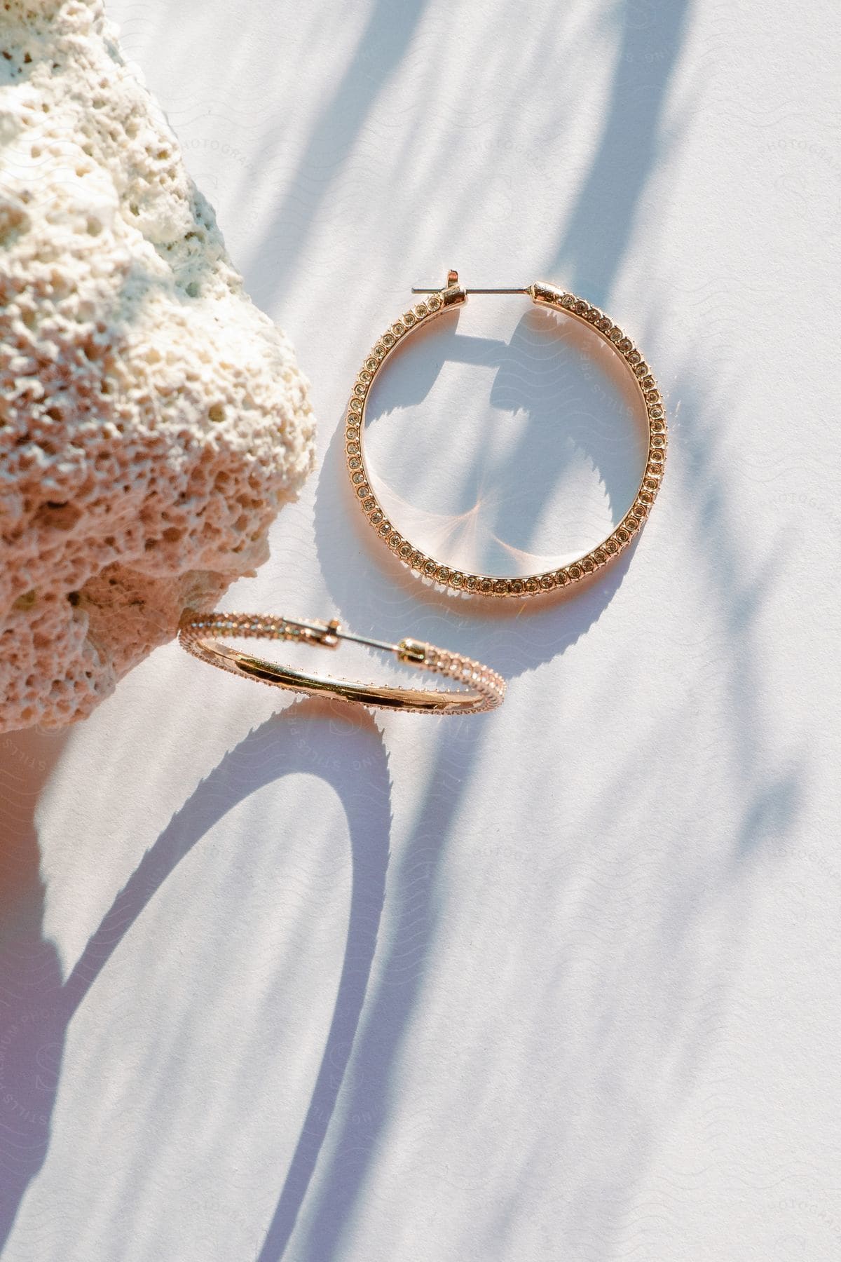 A view of some earrings sitting on a table.