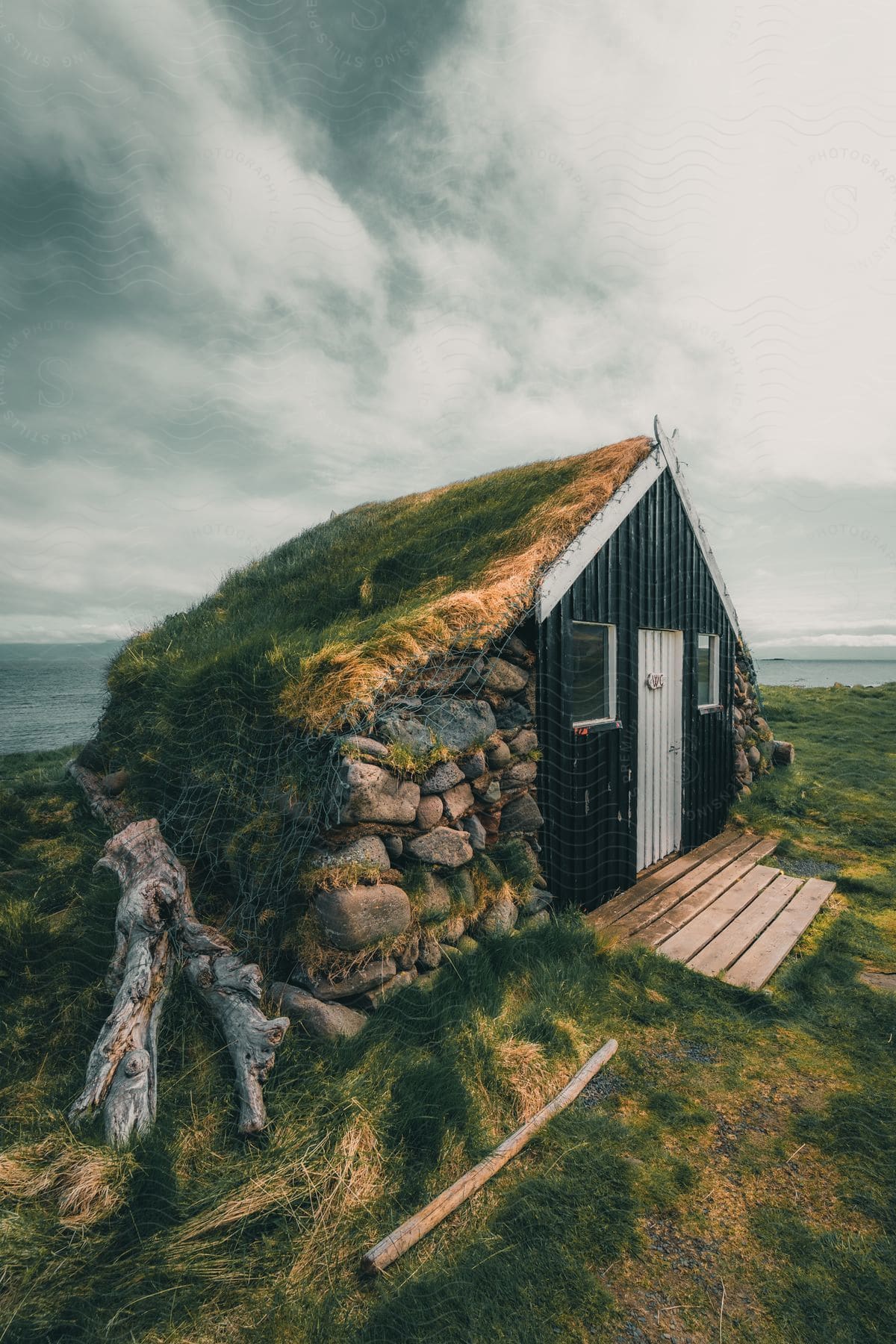 a traditional Icelandic turf house, built with a wooden frame and covered in earth.