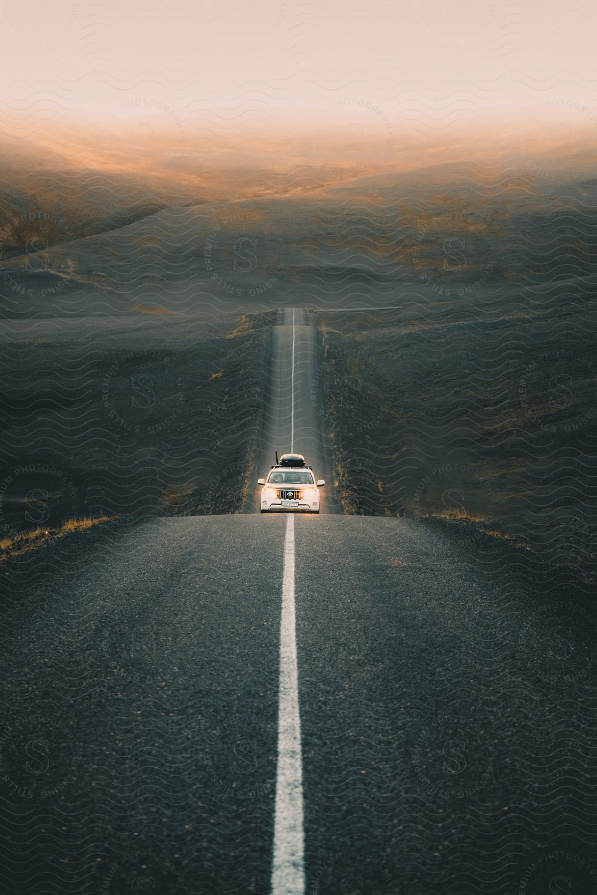 A car driving down a wavy road.