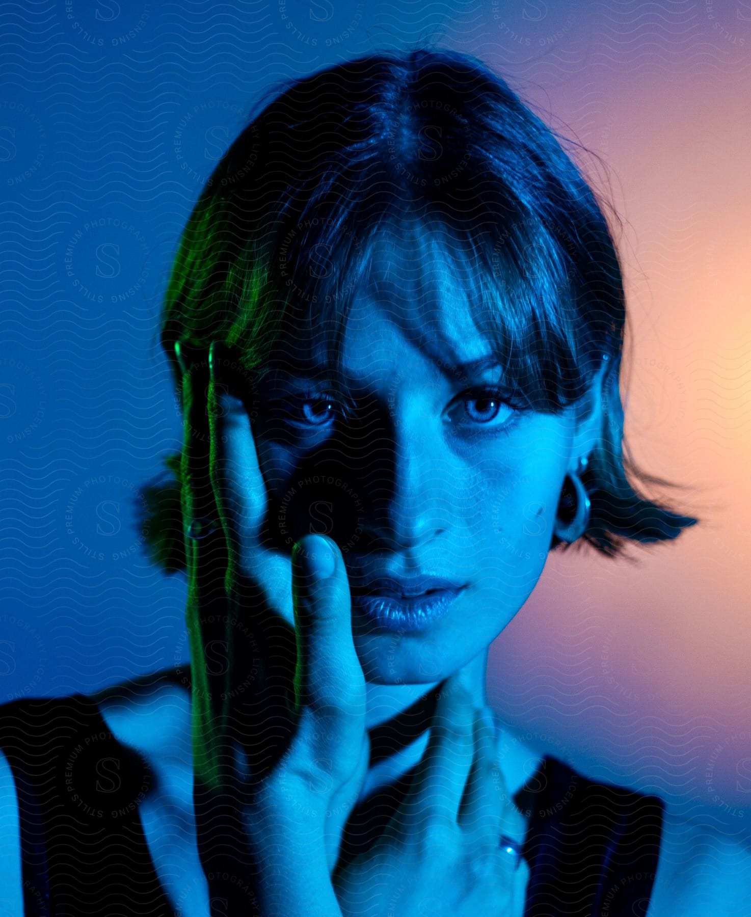 a young lady staring lustfully with one hands on her neck and the other on her cheek