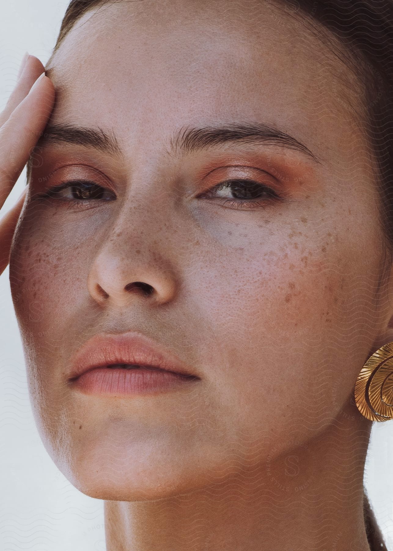 A Close Up Portrait Of A Woman's Face Outdoors On A Sunny Day