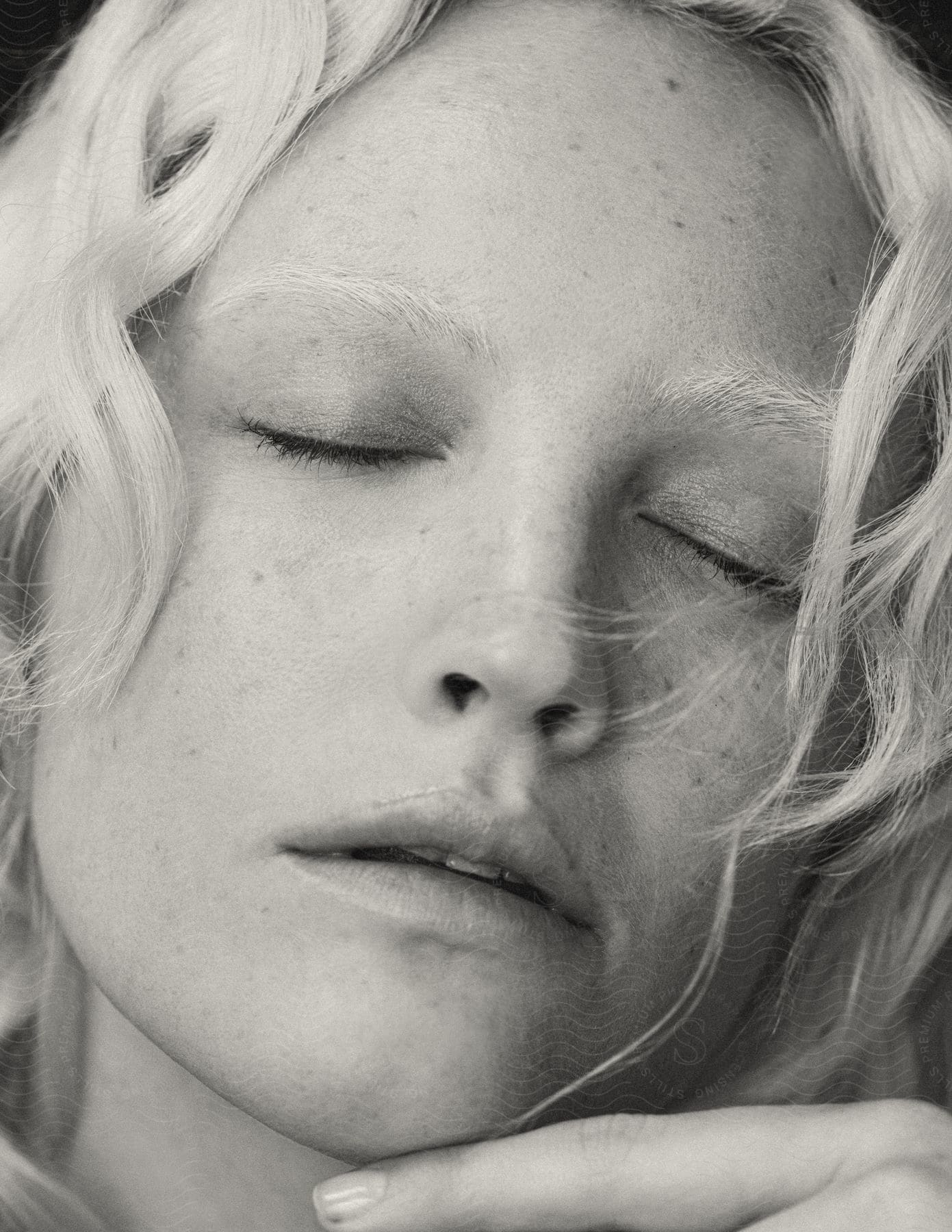 Close-up of a white woman's face with blonde eyebrows.