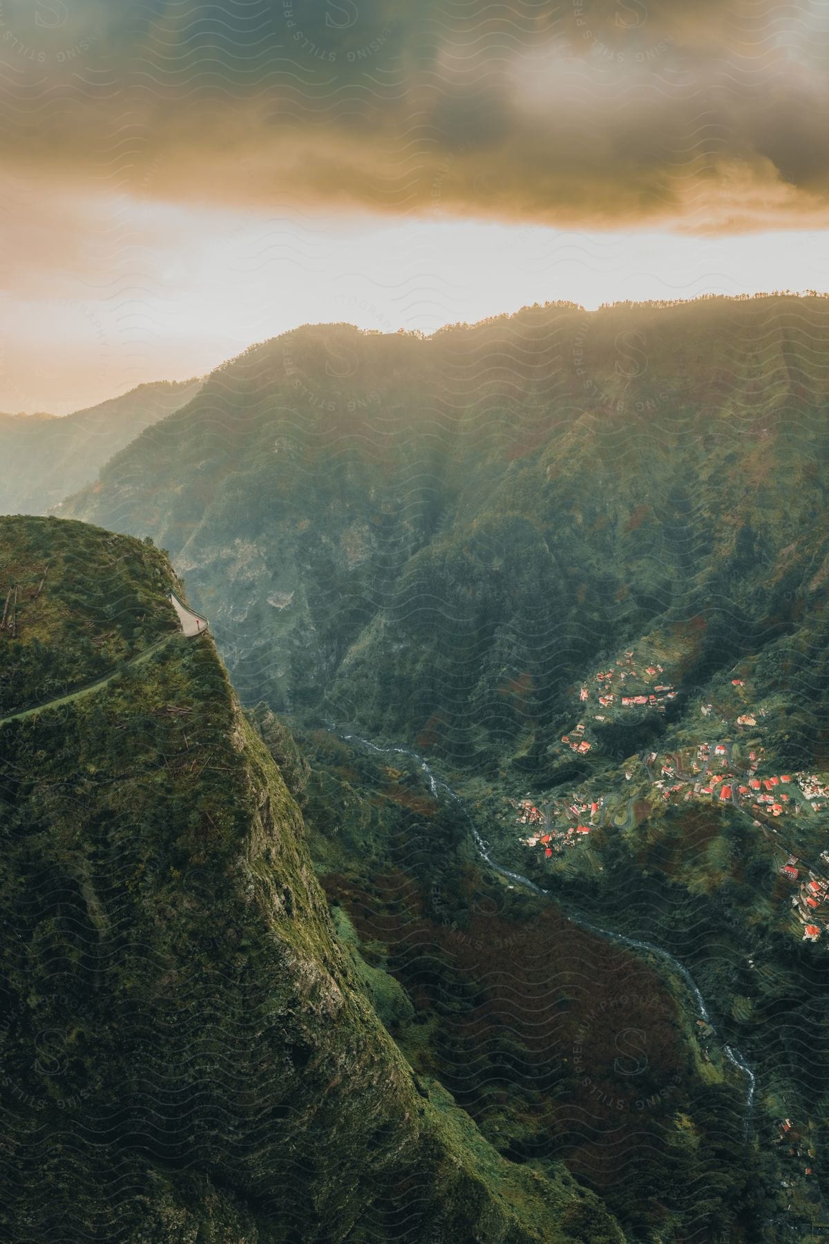 Natural panorama with green mountains of vegetation on a cloudy day with a red sky