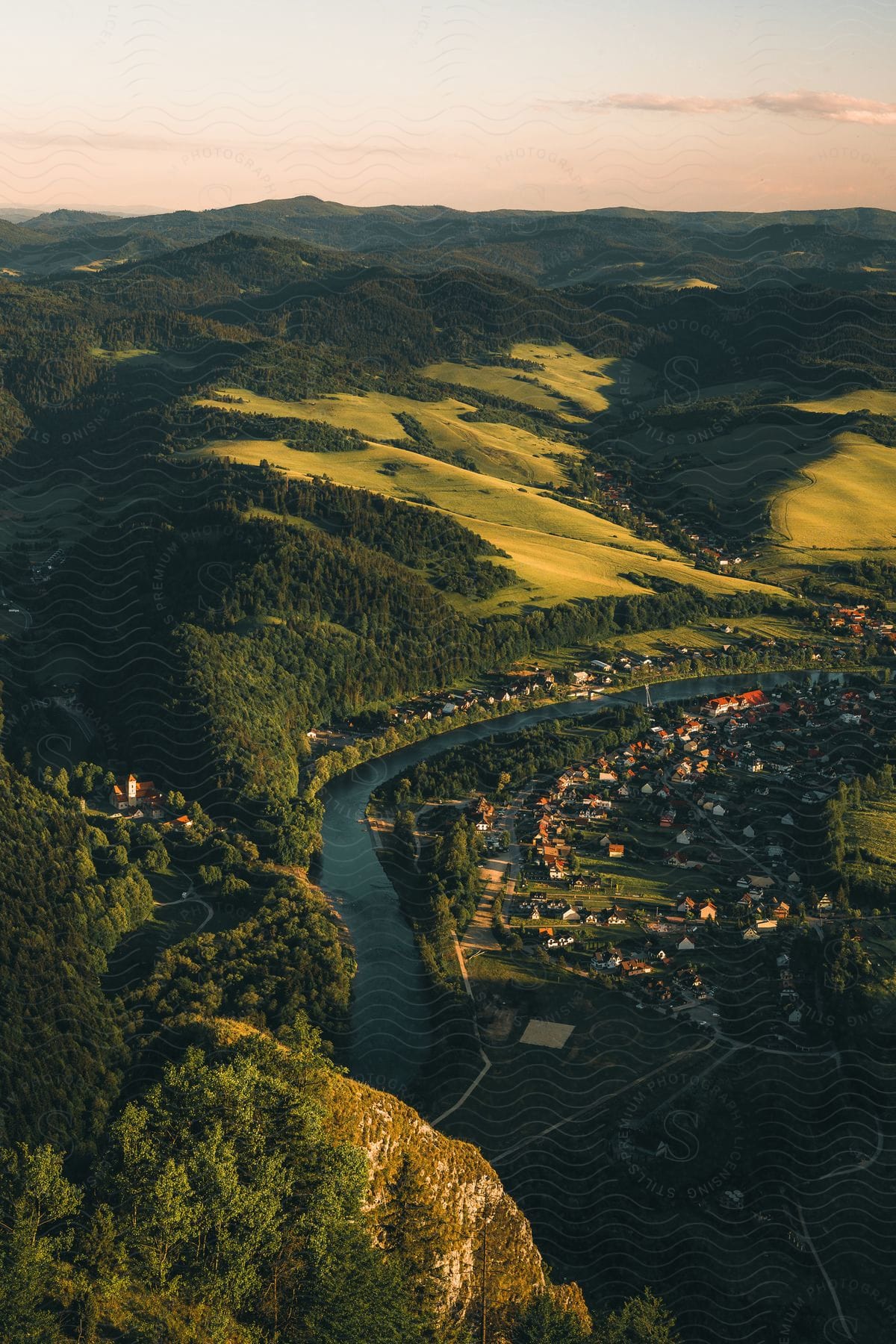 a city near the coast of a body of water while the sun is shining down