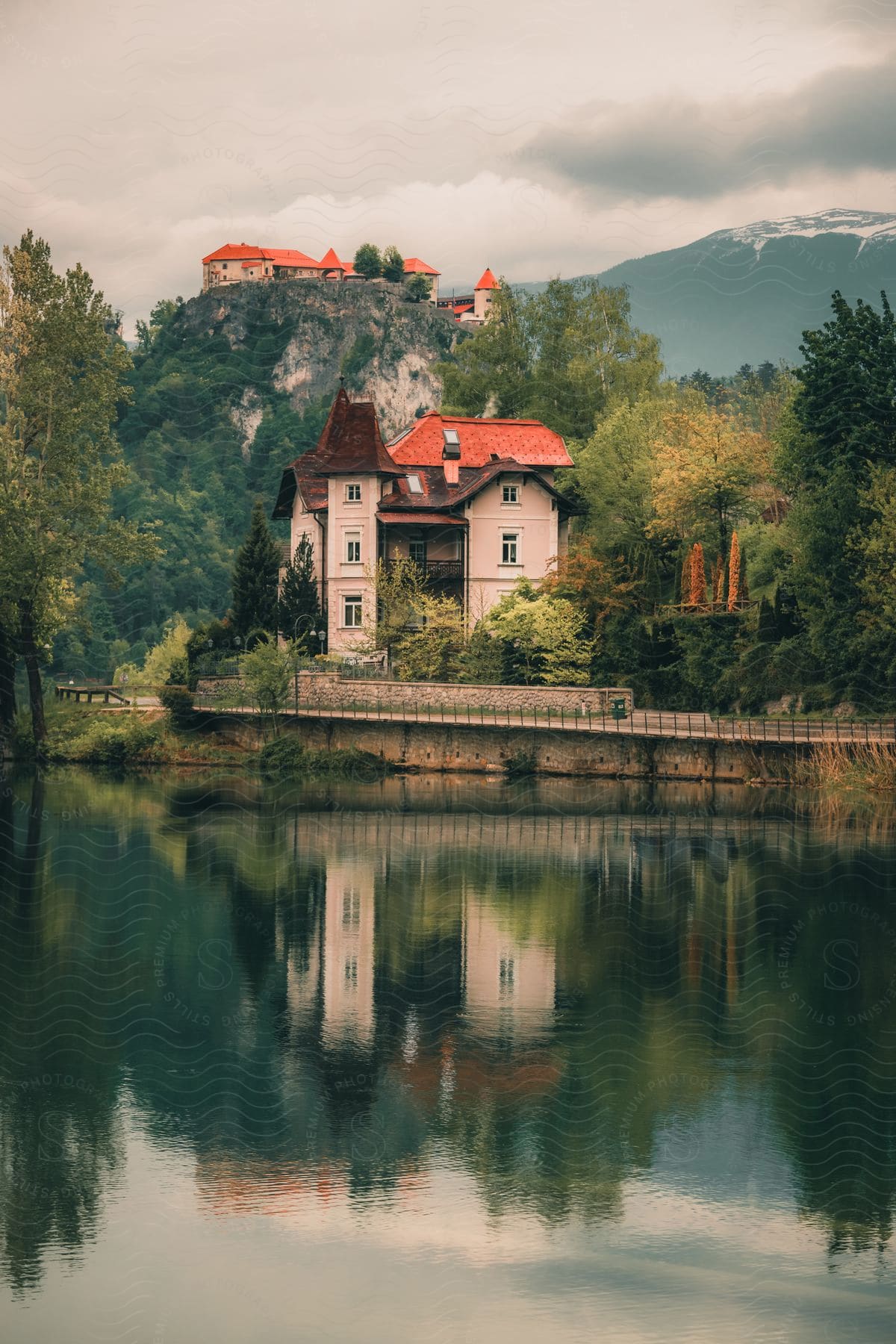 A view of a building out along the edge of a lake.