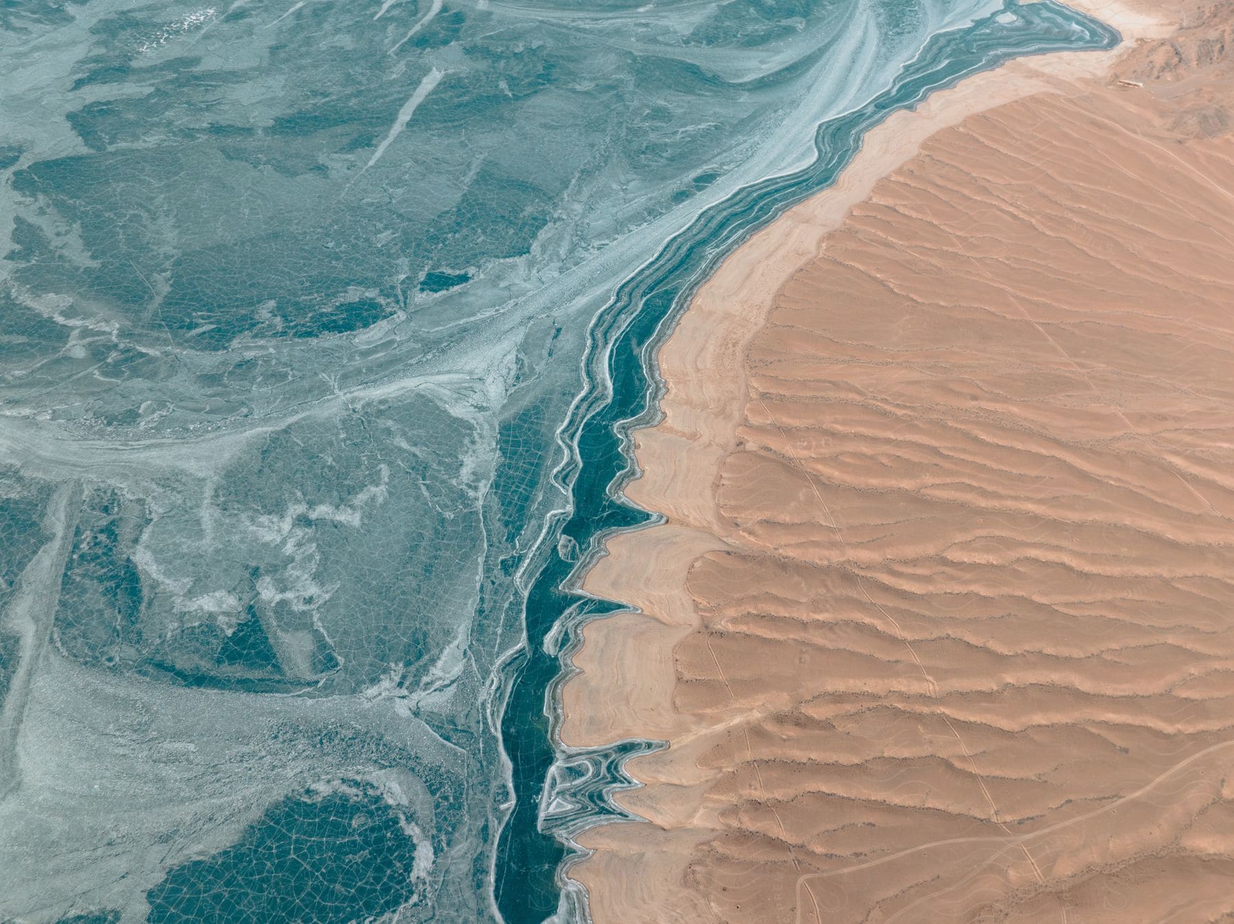 Aerial landscape of an island with turquoise sea and clear sand