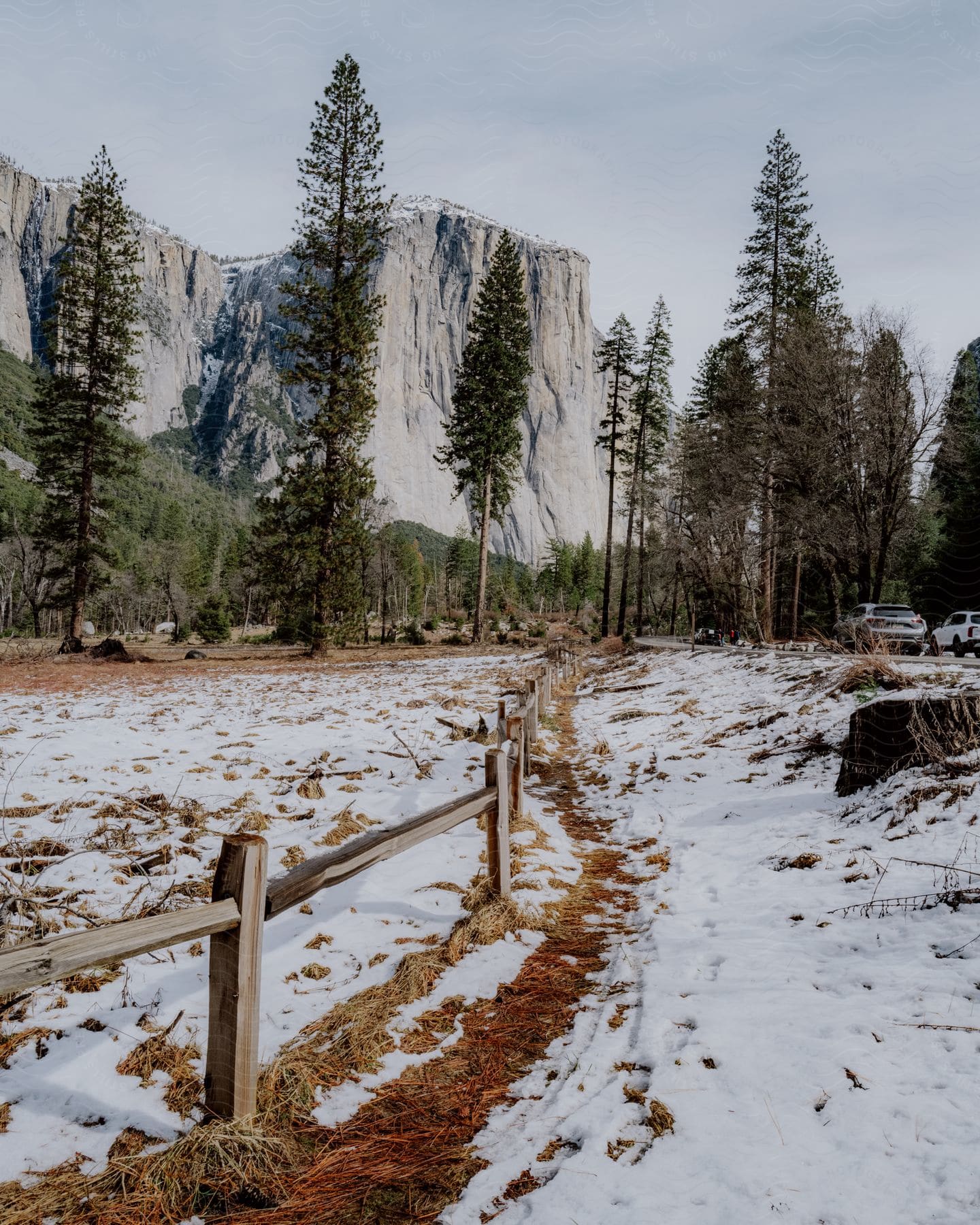 A view of a landscape with mountains and snow.