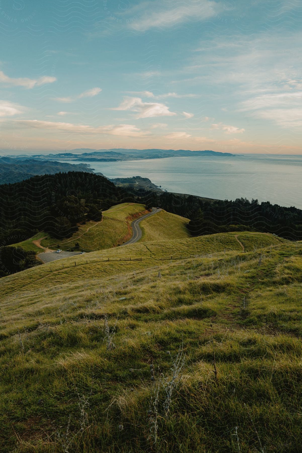 A view of some rolling hills with grass on them.