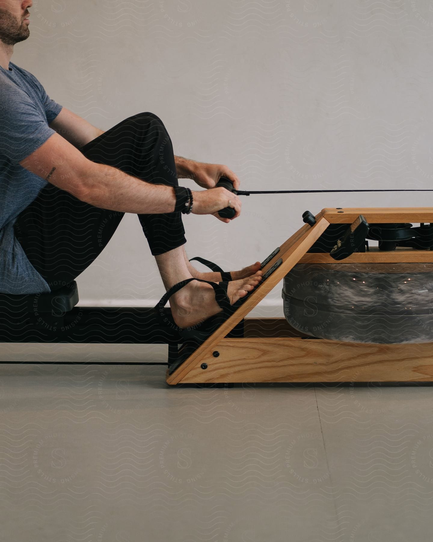 A man exercising in an empty room.