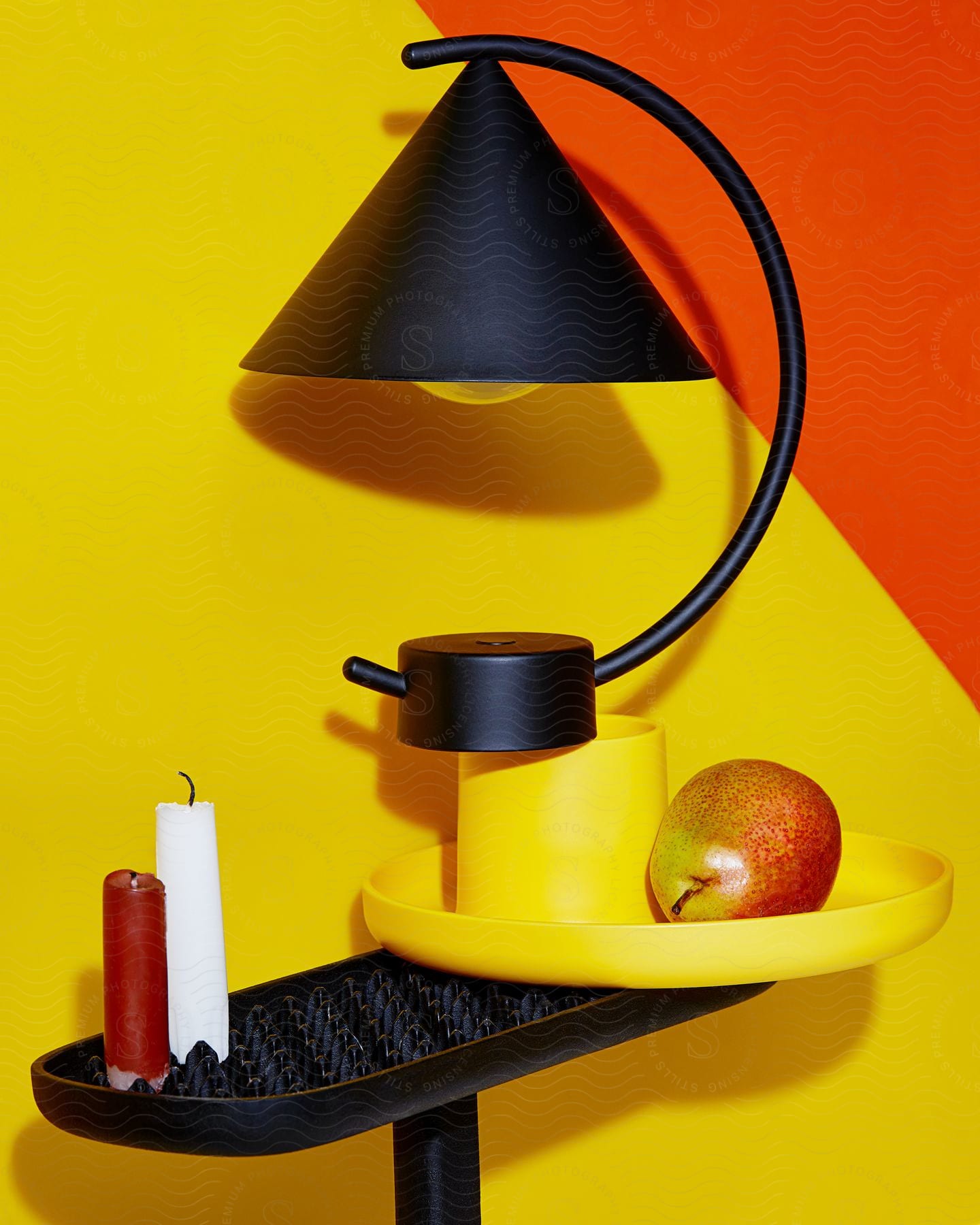 A view of a lamp and decor items on a table.