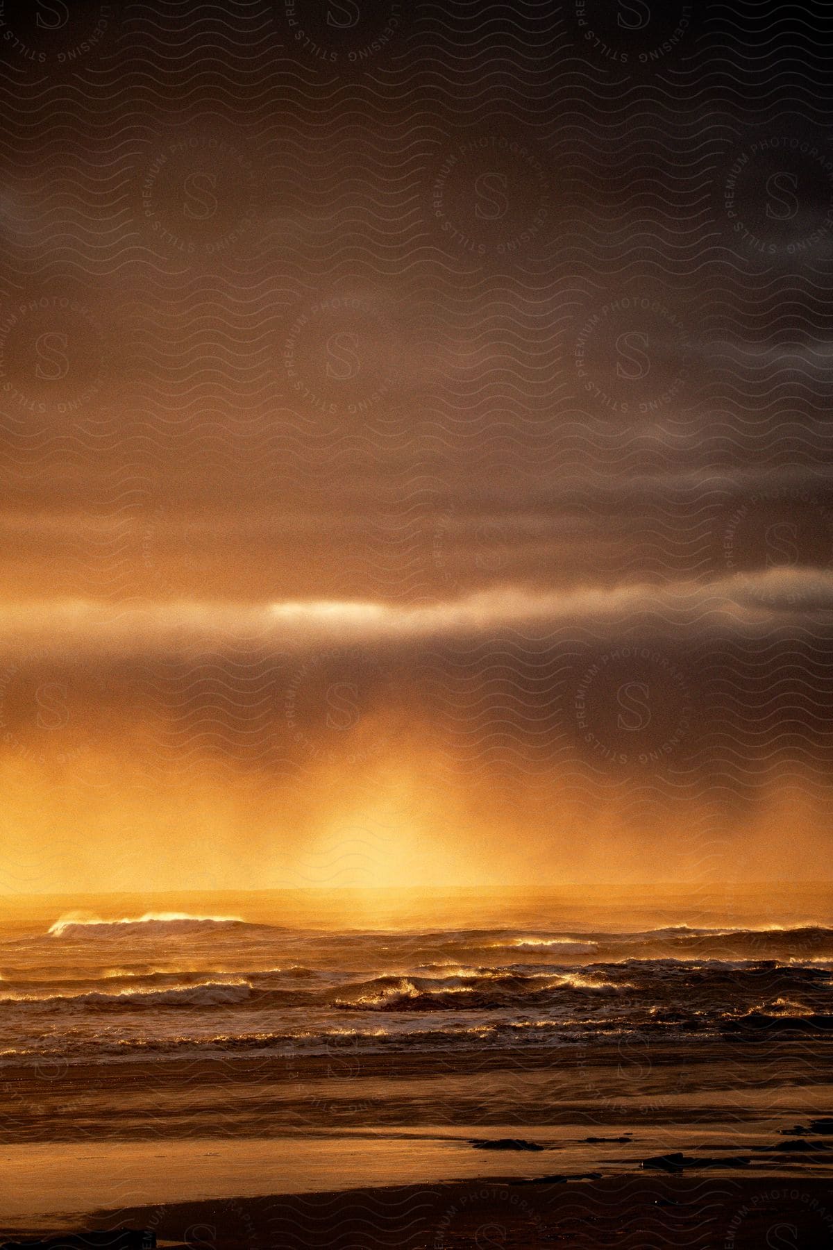 A view of the coast with some clouds over the ocean.