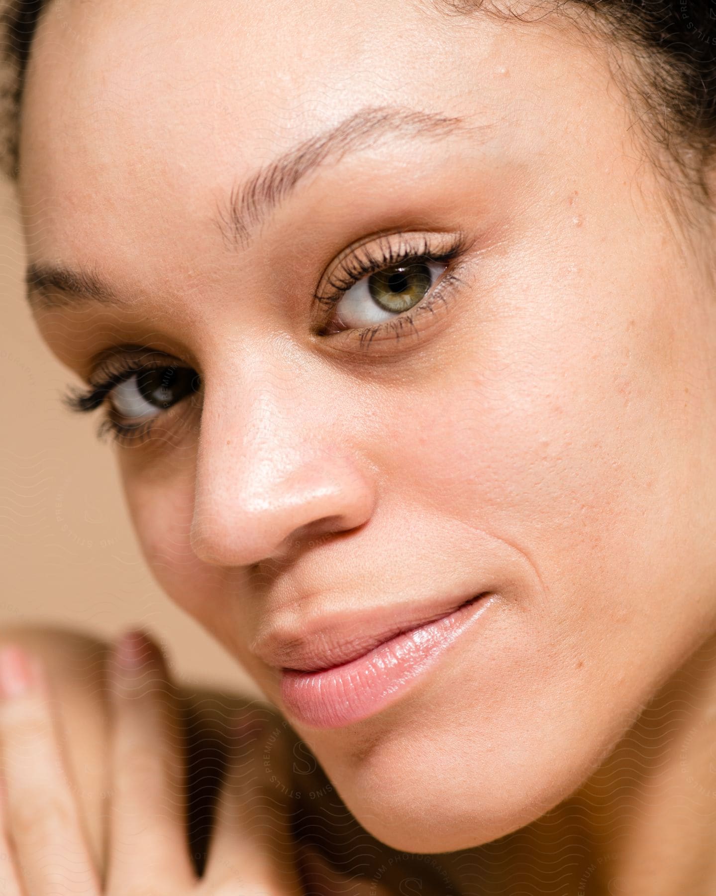 Woman with a slight smile on her face as she looks into the camera