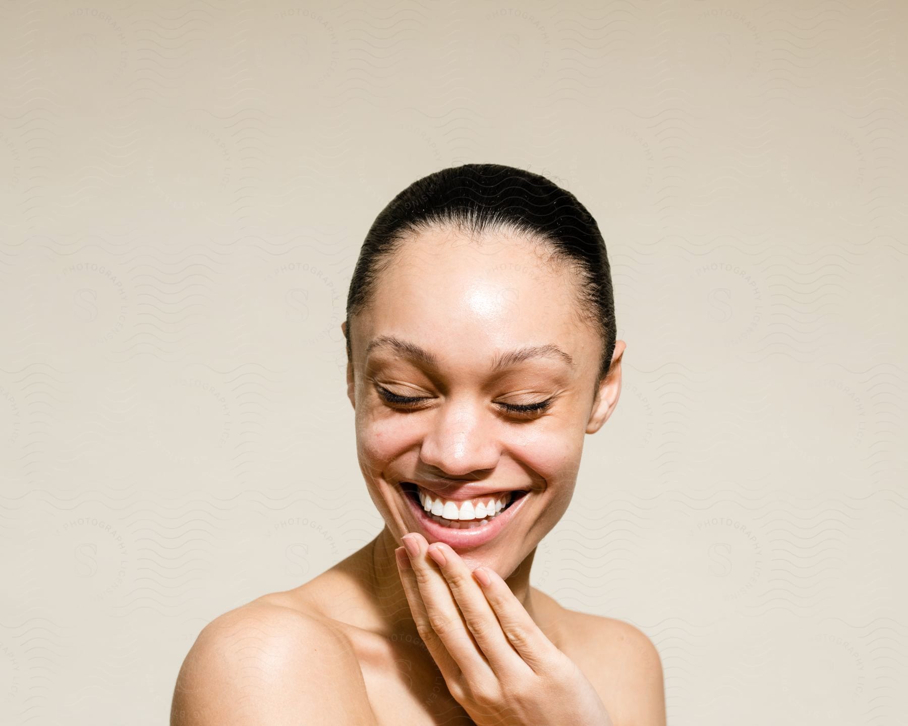 Close-up of the face of a smiling dark-haired woman.