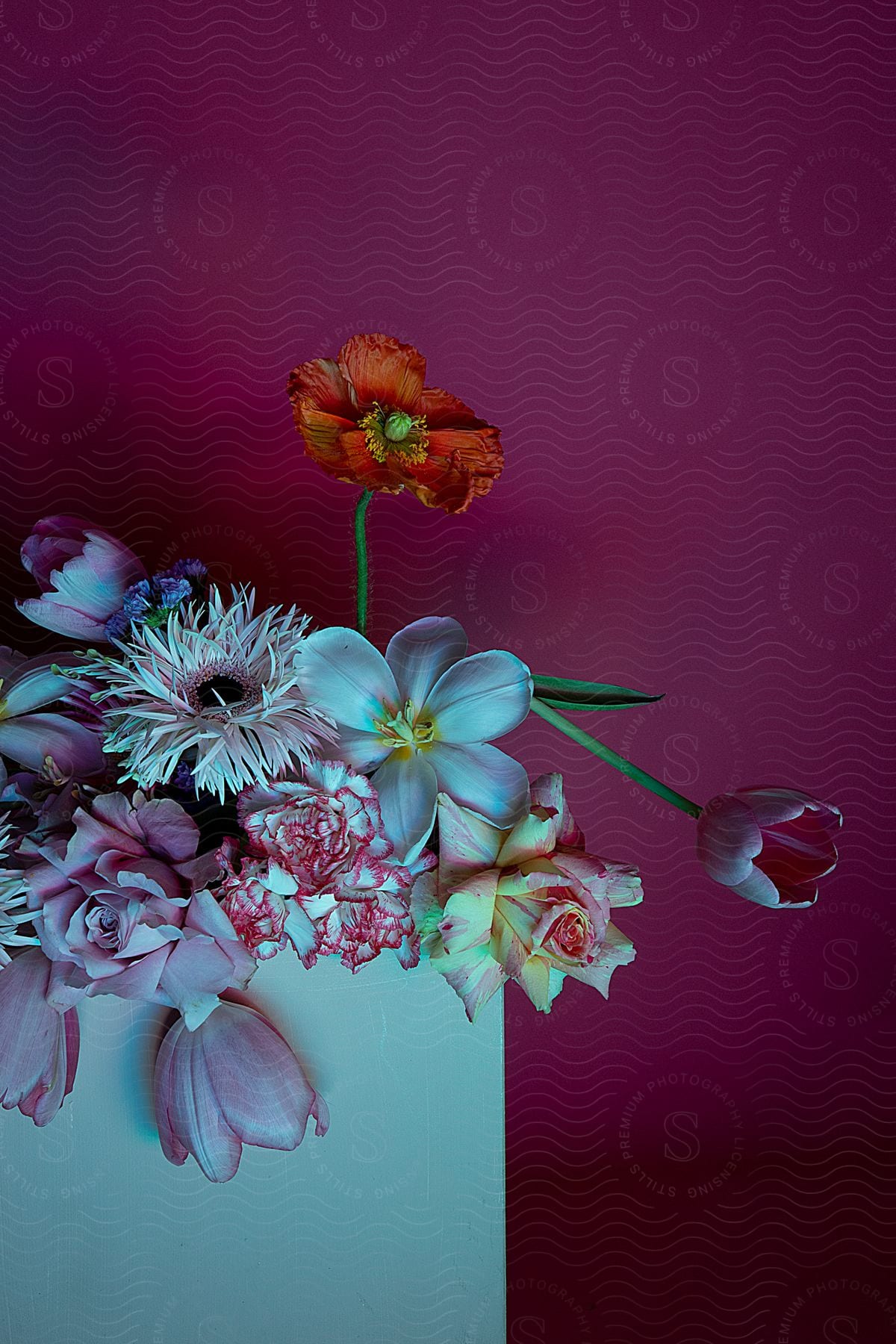 A flower arrangement on a square vase