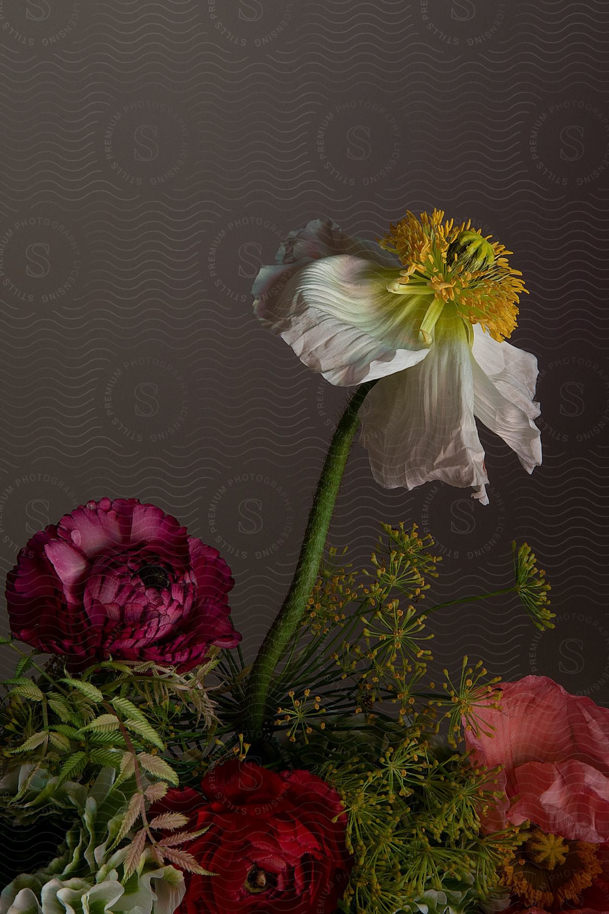 Some flowers in a bouquet sitting on a table.