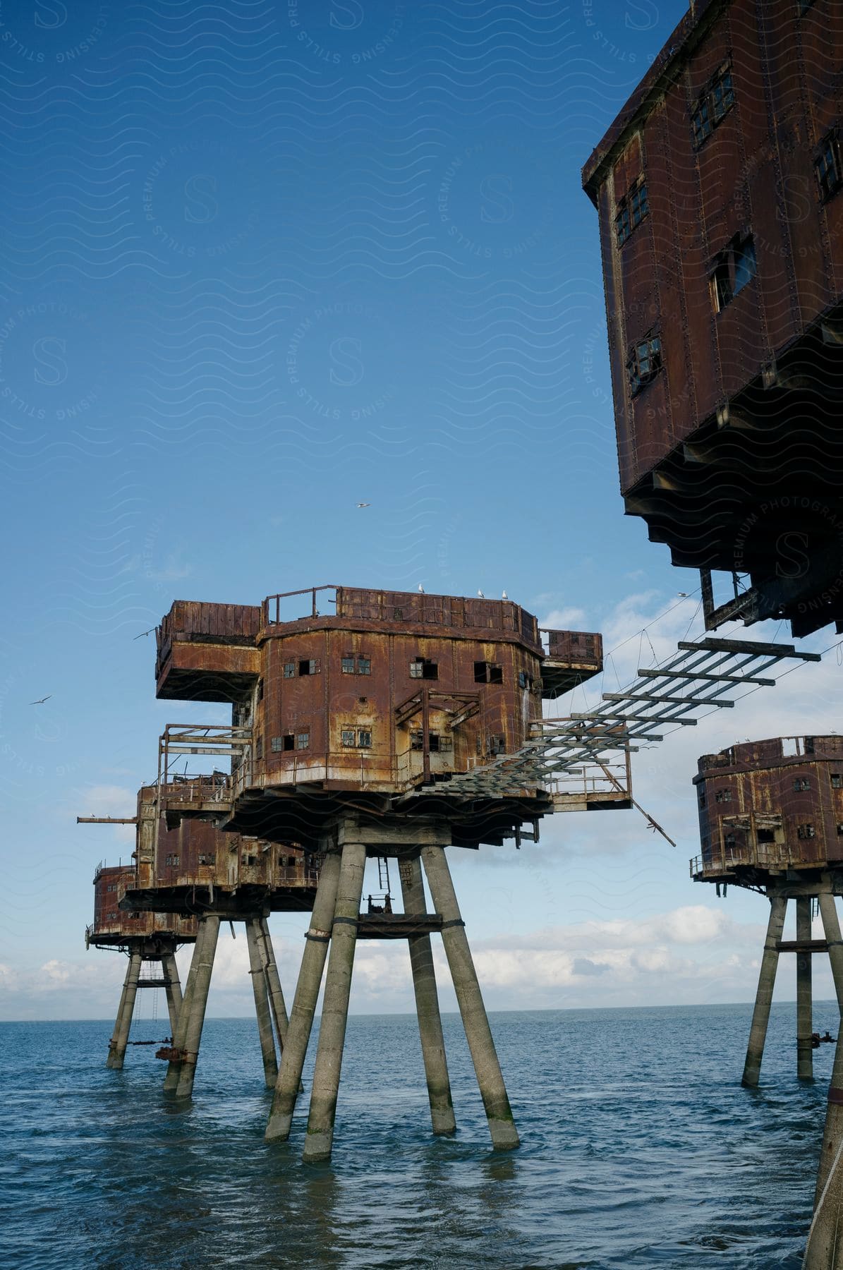 Maunsell Forts in the middle of the sea on a blue sky day.