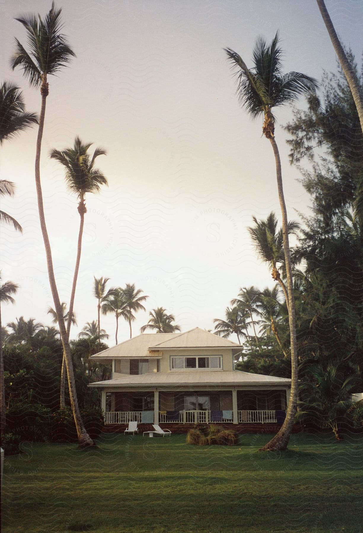 Exterior architecture and facade of Casa Ana Playa Bonita in natural and tropical environment on a morning.