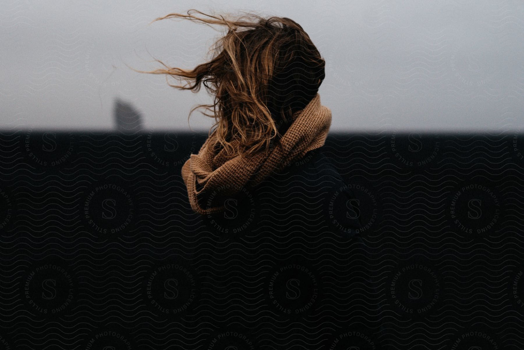 A woman modeling a scarf