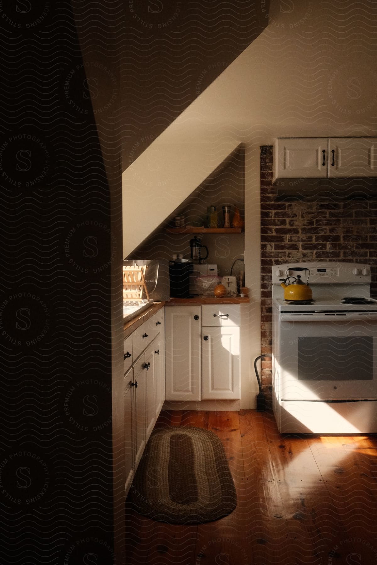 Interior design of a kitchen with blank counters stove and household utensils