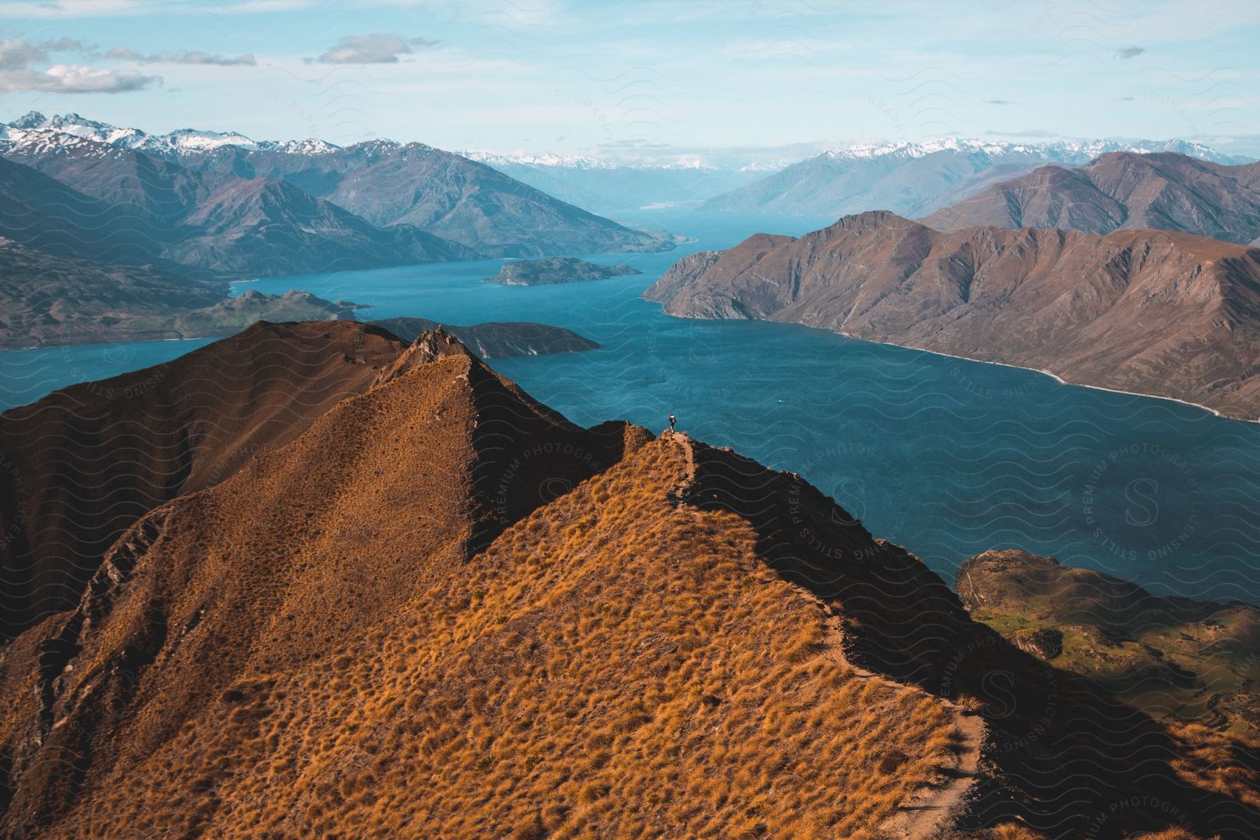 A view of some mountains with a lake at the base of them