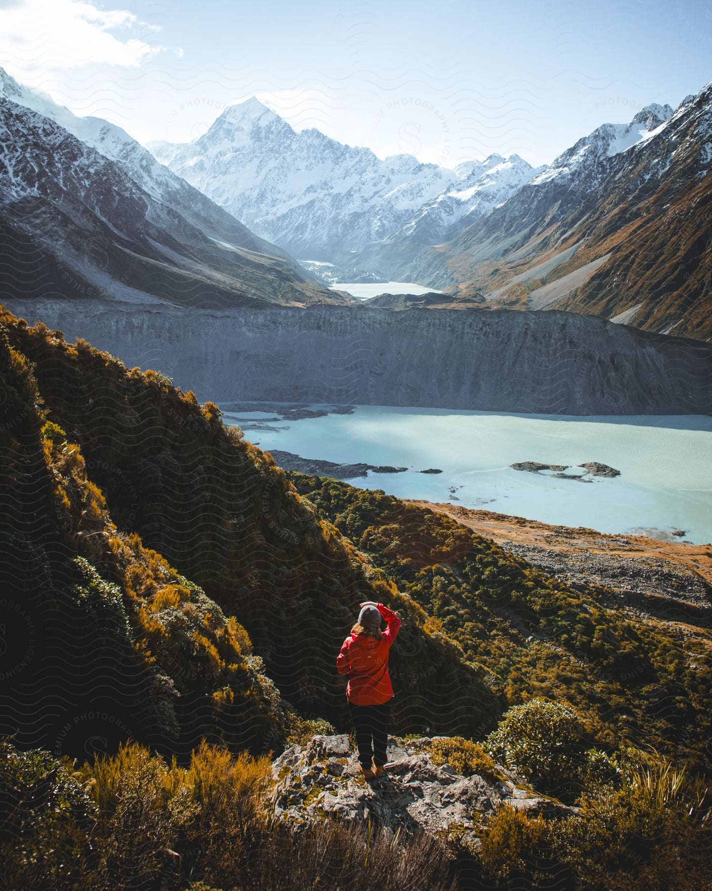 A woman hiking outdoors on a sunny day.