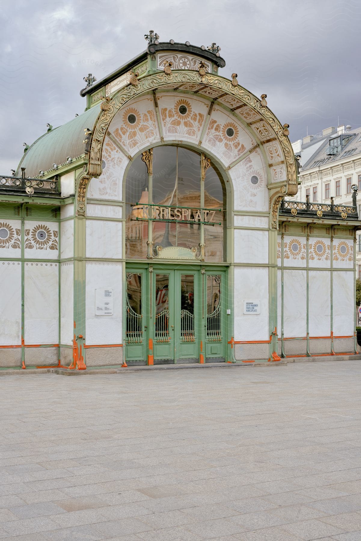 Exterior facade of Karlsplatz Metro Station on a cloudy day