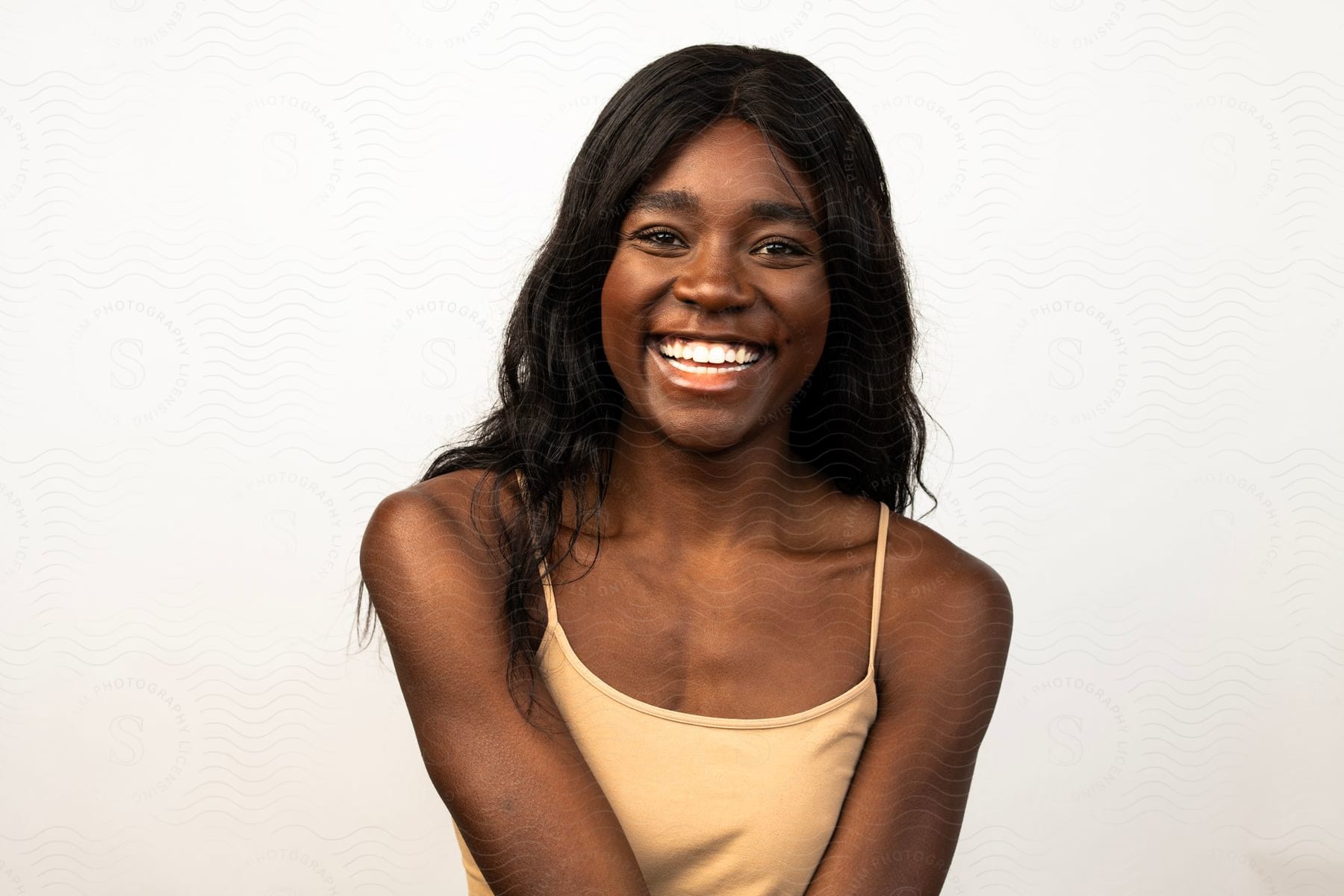 A portrait of a woman smiling on a sunny day.