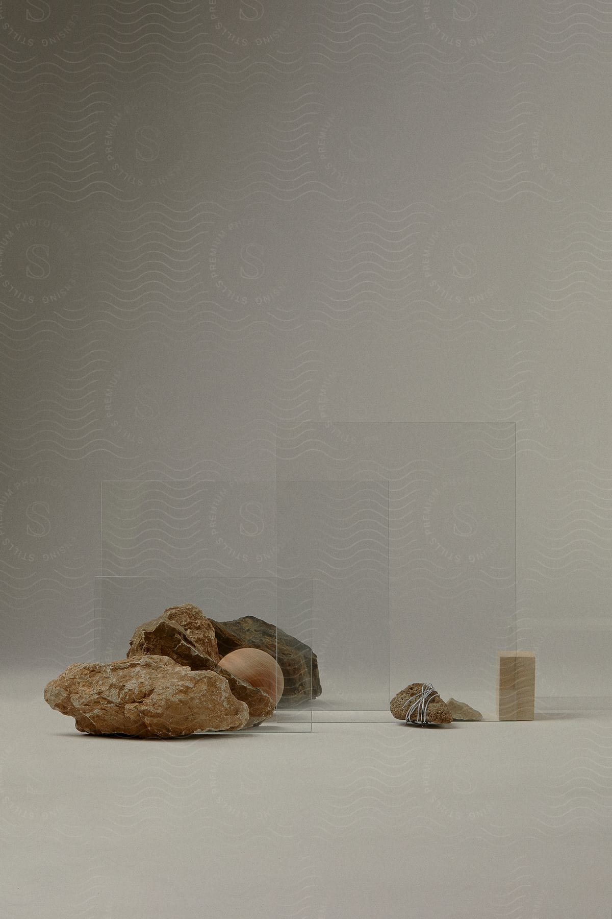 Grouping of rocks and wooden block arranged as still life