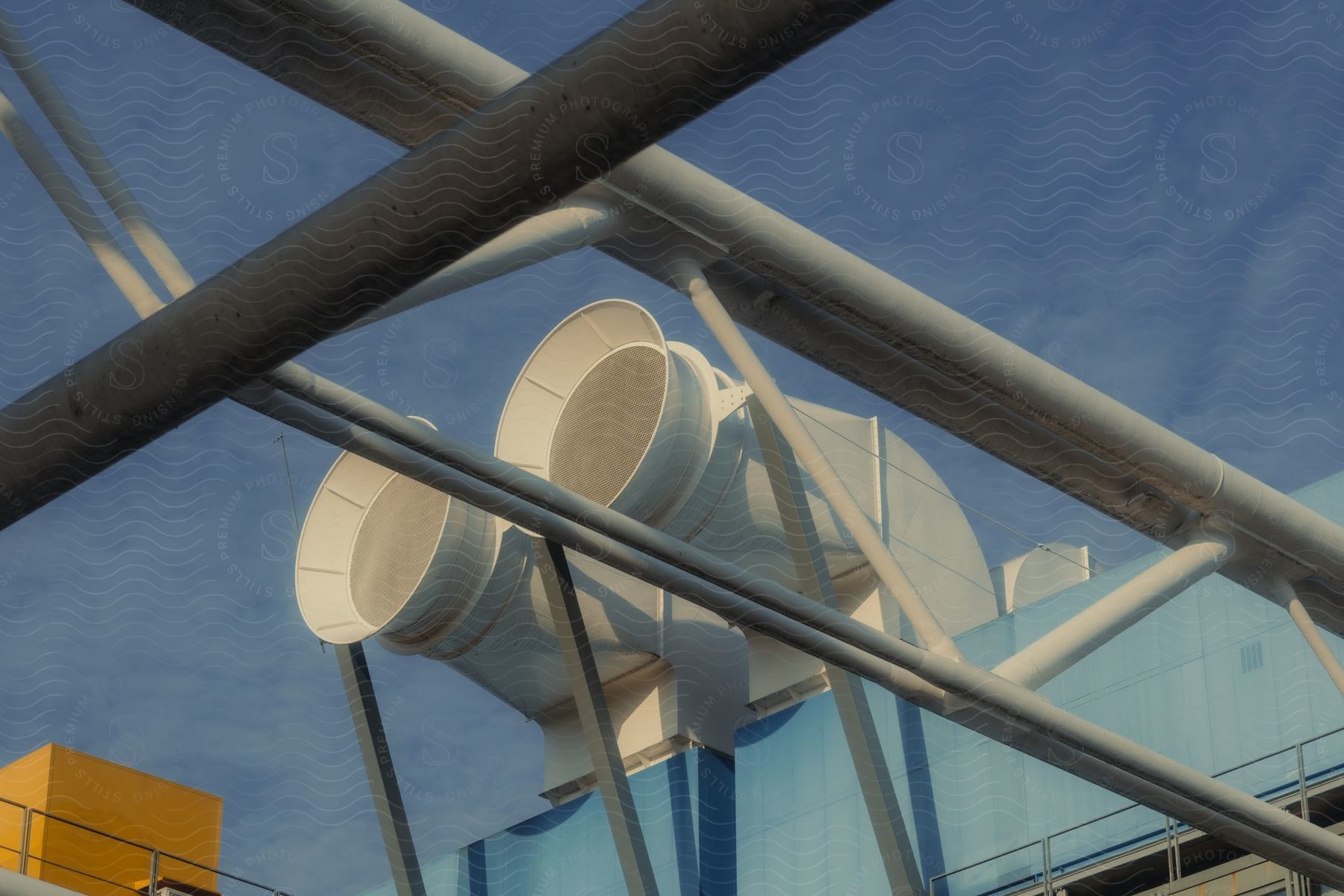 Two large air vents on the roof of a building.