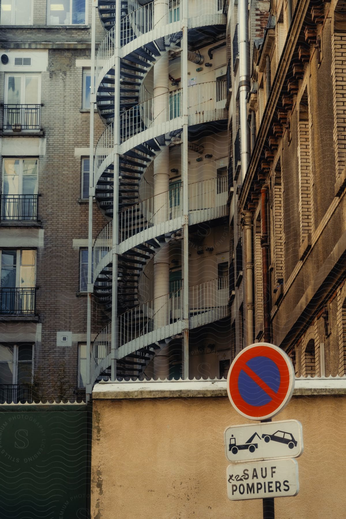 A building with the stairs on the outside, moving upward