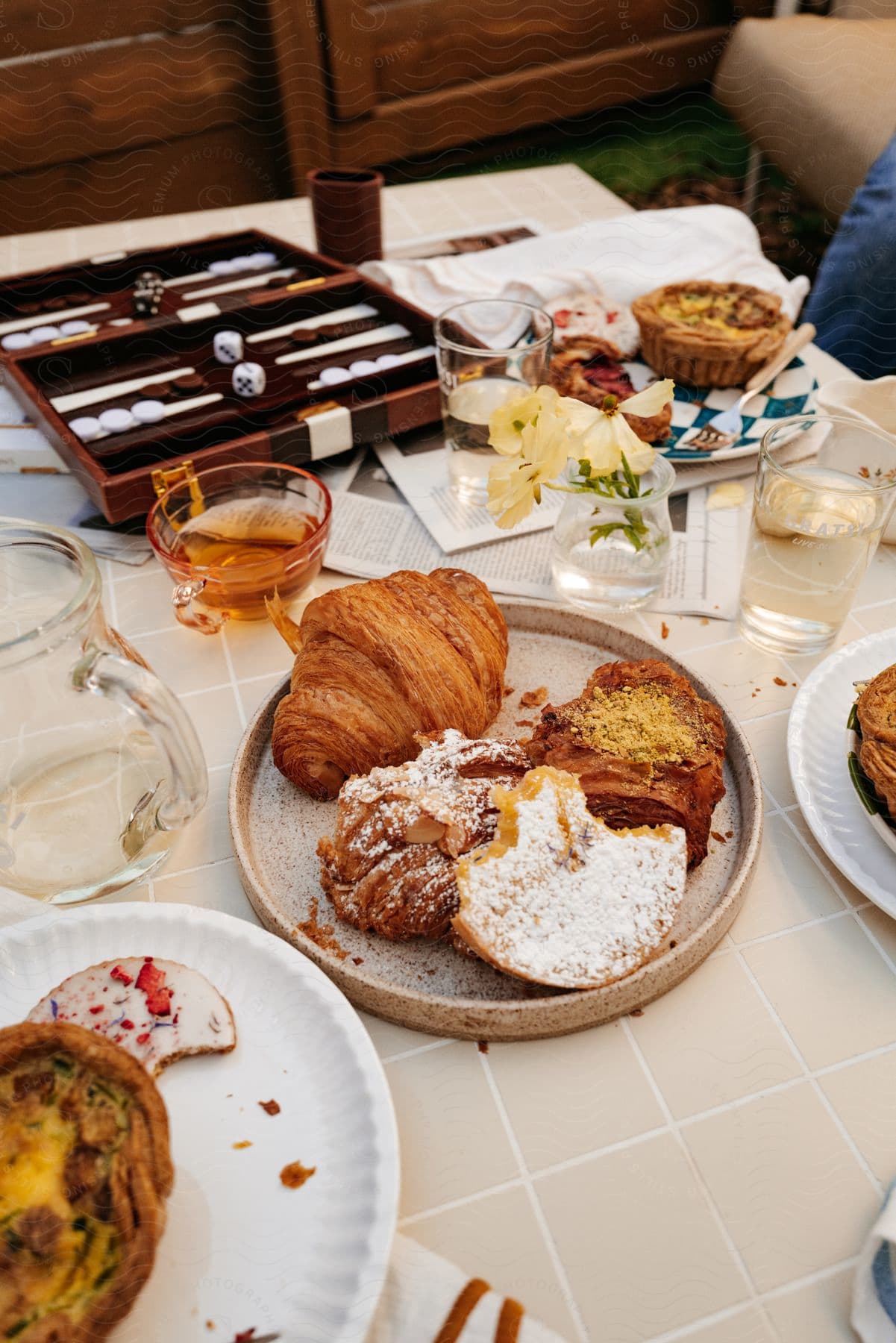 Table with sweet and savory pastries and glasses