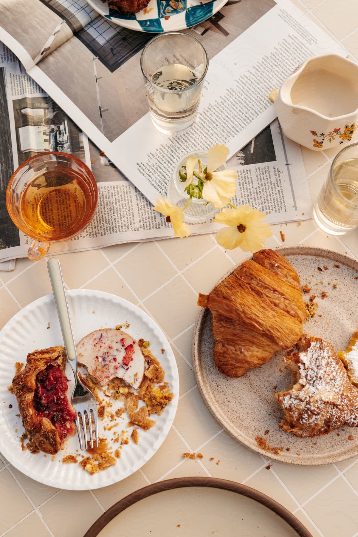 Close-up on a table with plates in glasses with sweet and savory puff pastries