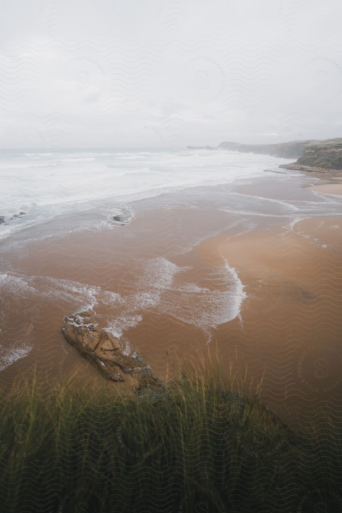 Natural landscape of a beach with a crust around on cloudy day