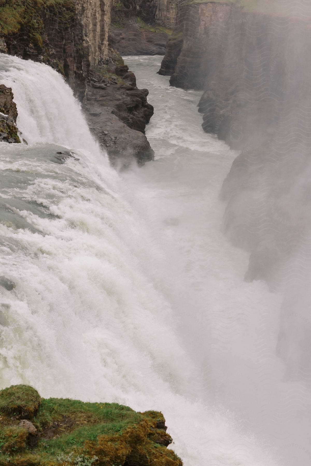 Landscape of an extensive waterfall with strong waters in free fall.