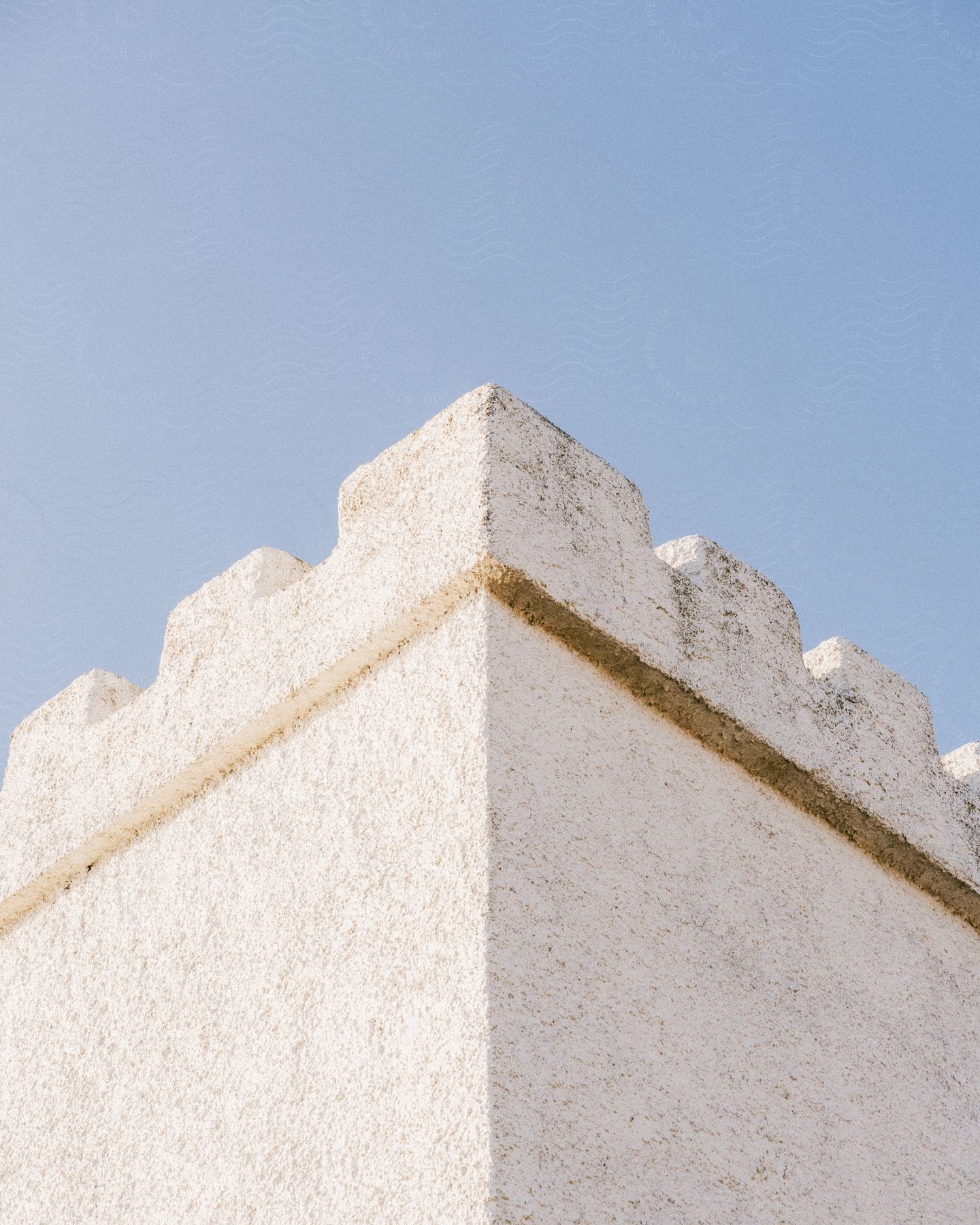 White Parapet wall against the blue sky