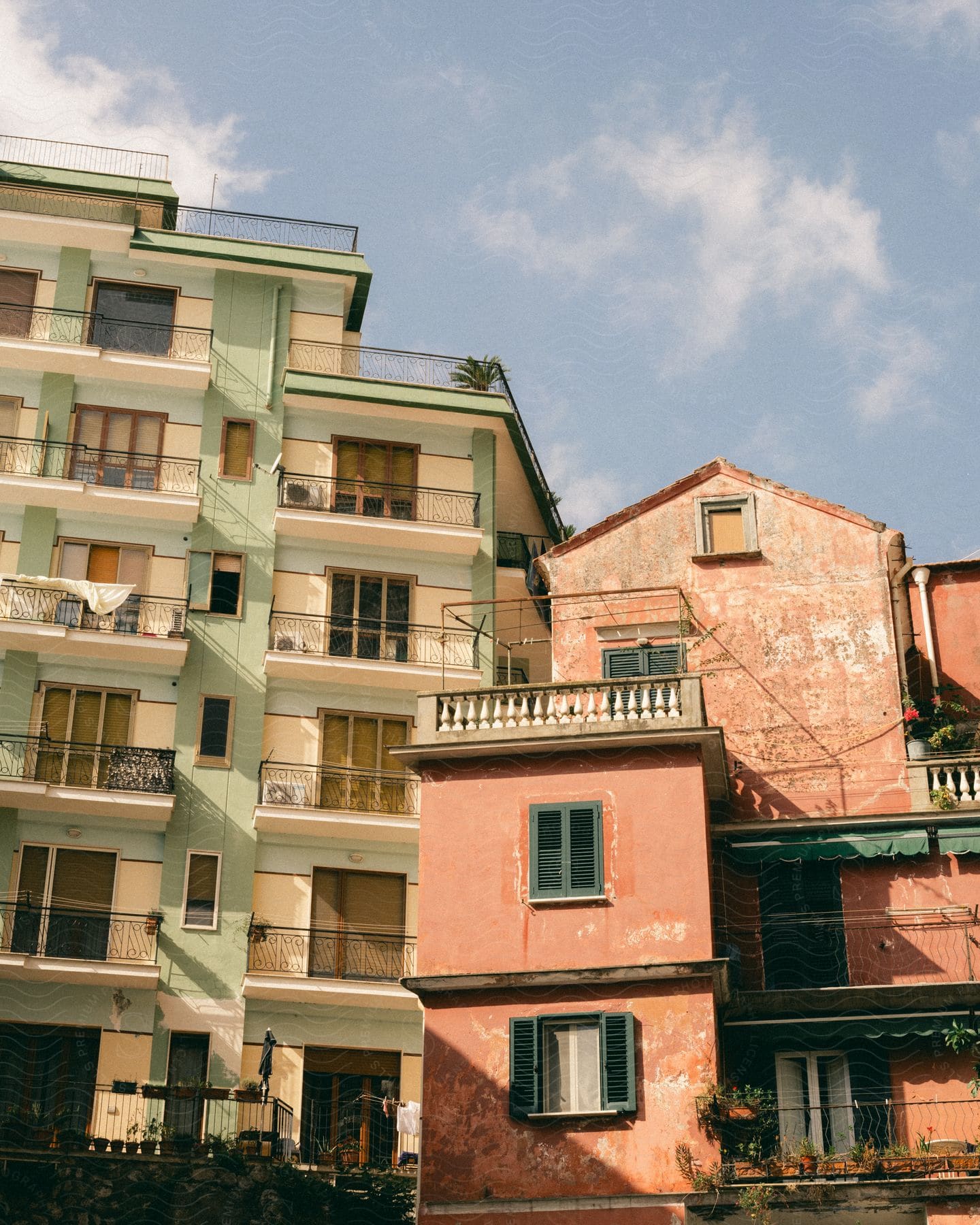 An exterior view of some buildings outdoors on a sunny day.