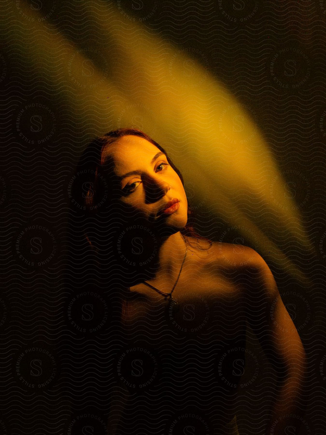 A young girl posing indoors