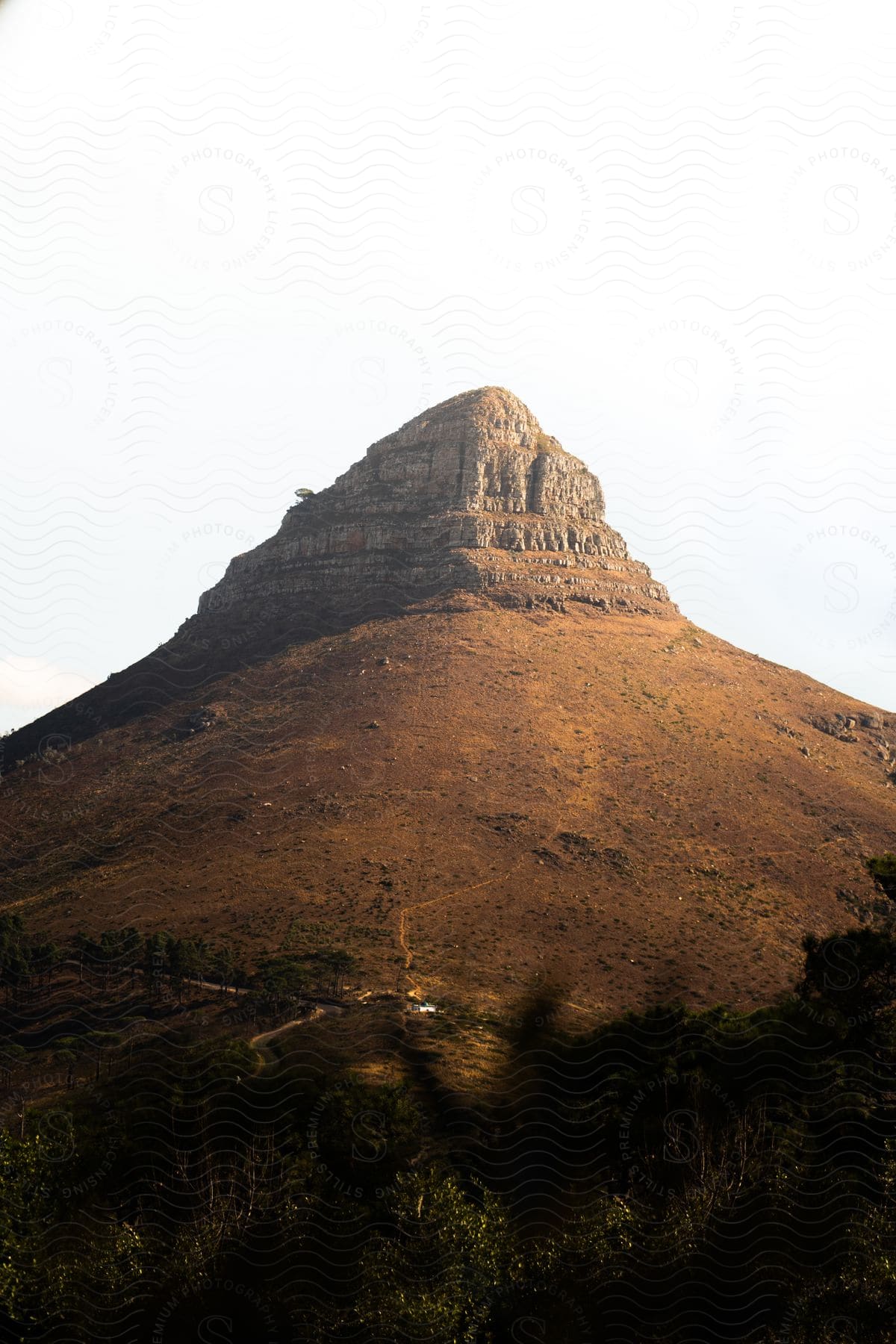 A mountain peak with a pointed shape stands against a clear sky
