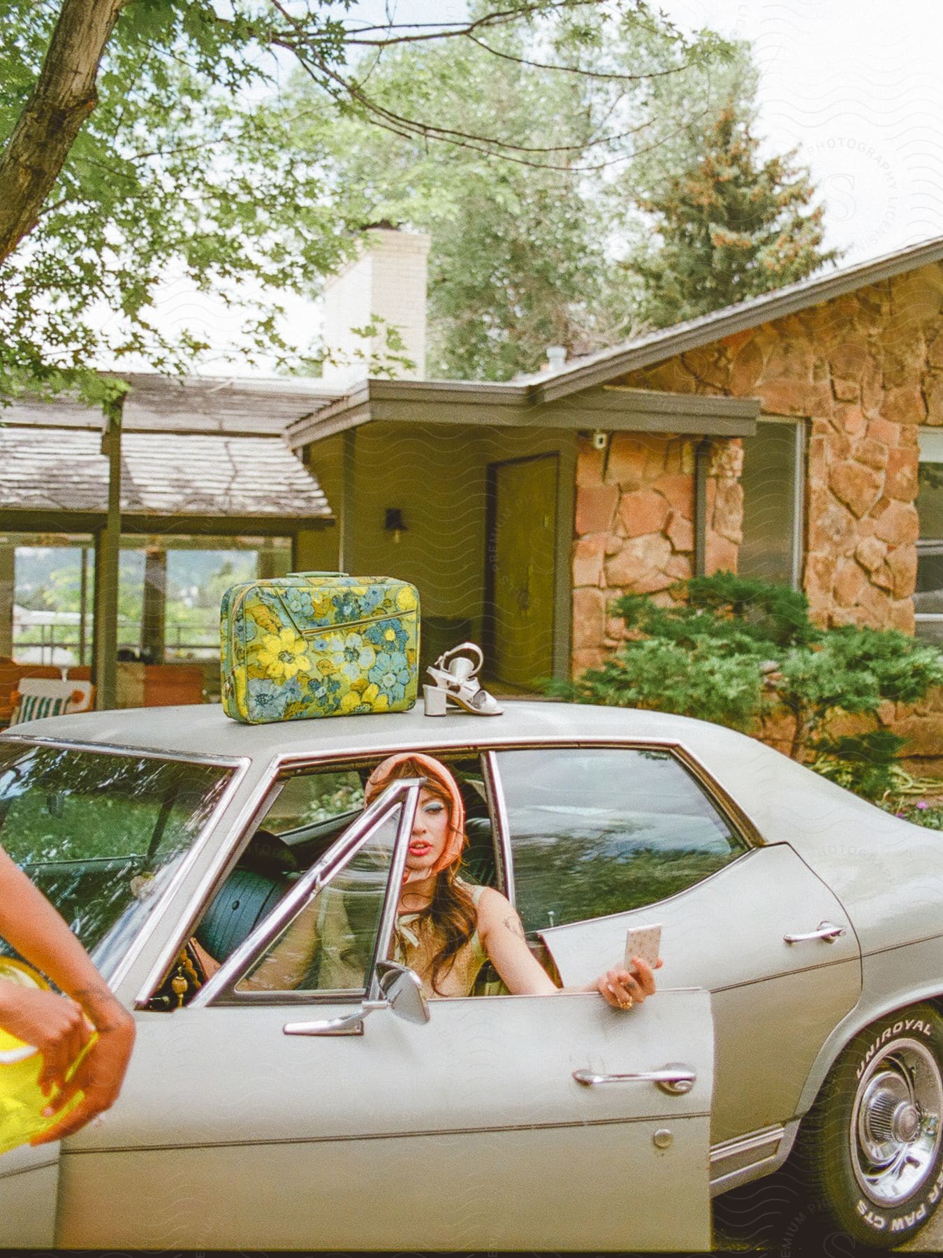 A woman getting out of a car